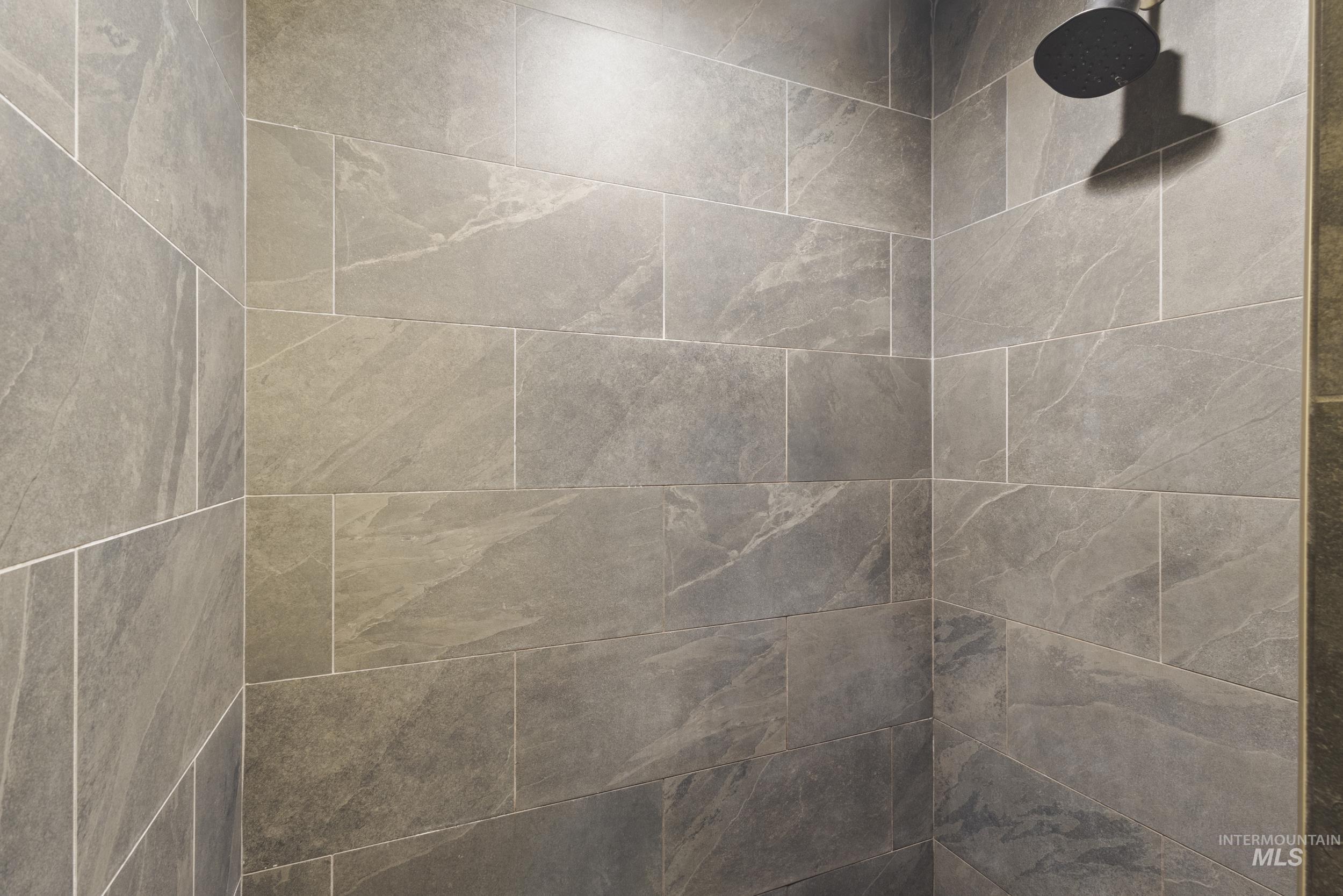 Bathroom view of a tile shower