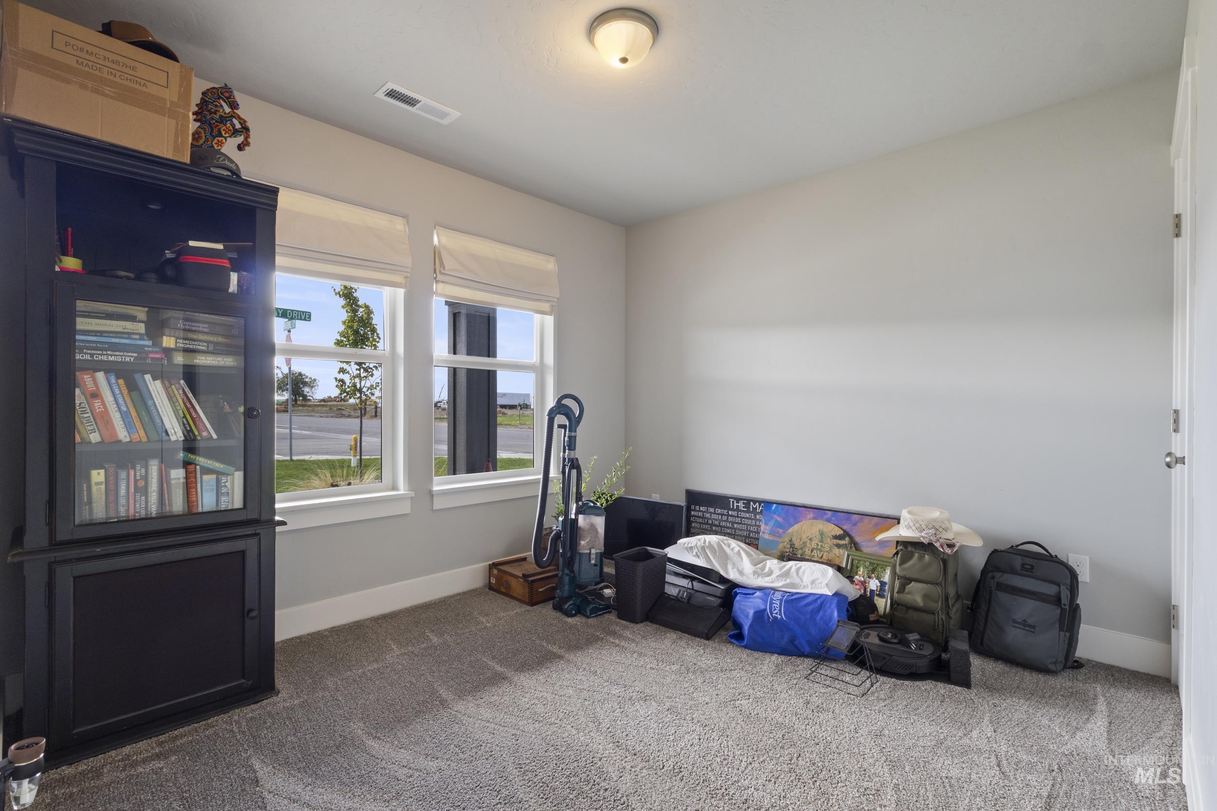 Recreation room with carpet and baseboards