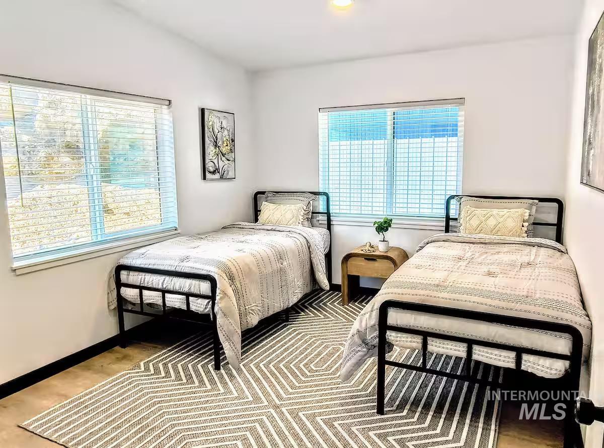 Bedroom #2 with wood finished floors and recessed lighting