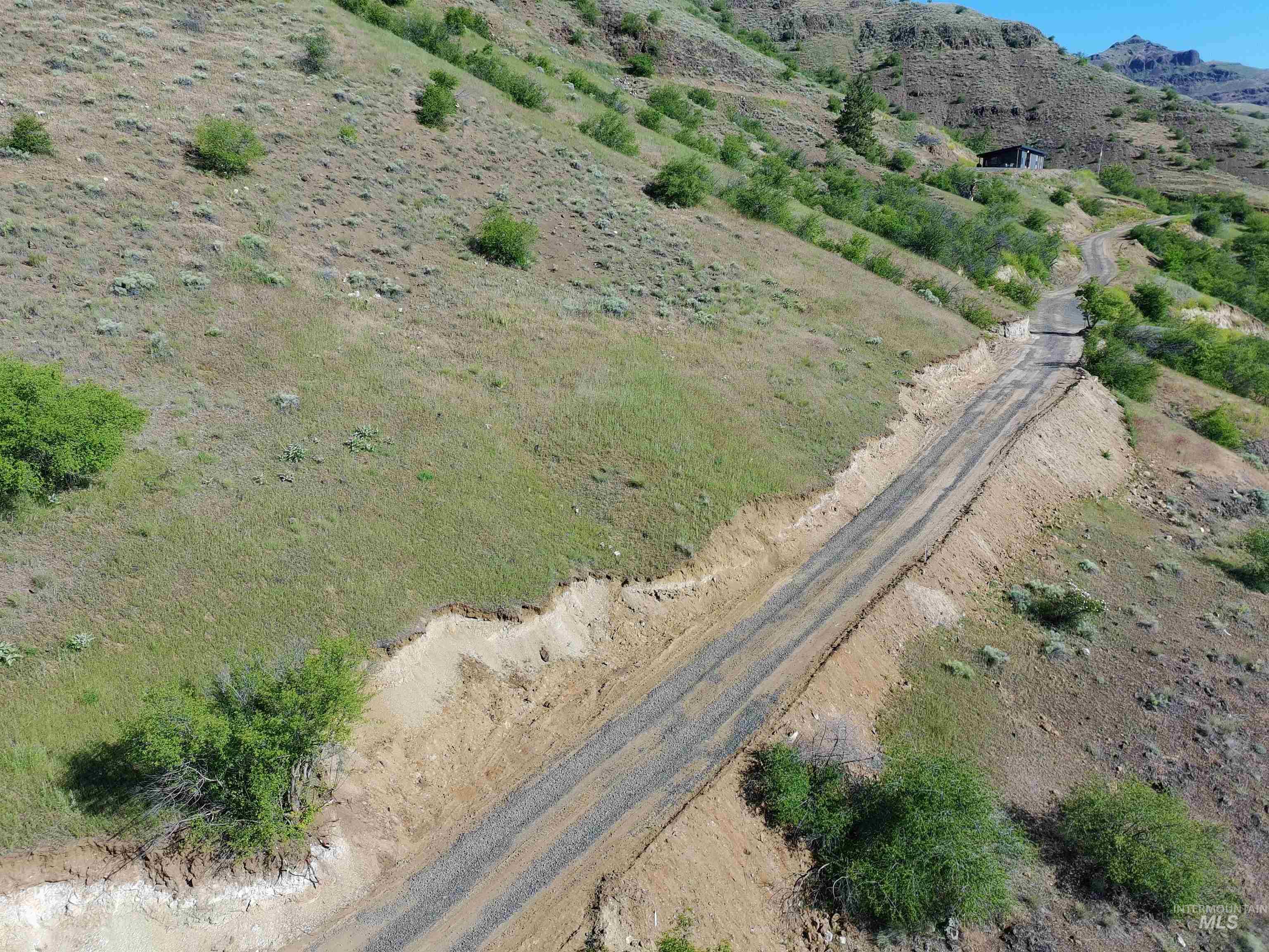 Aerial view of driveway and surrounding area