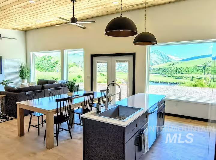 Sunroom featuring french doors