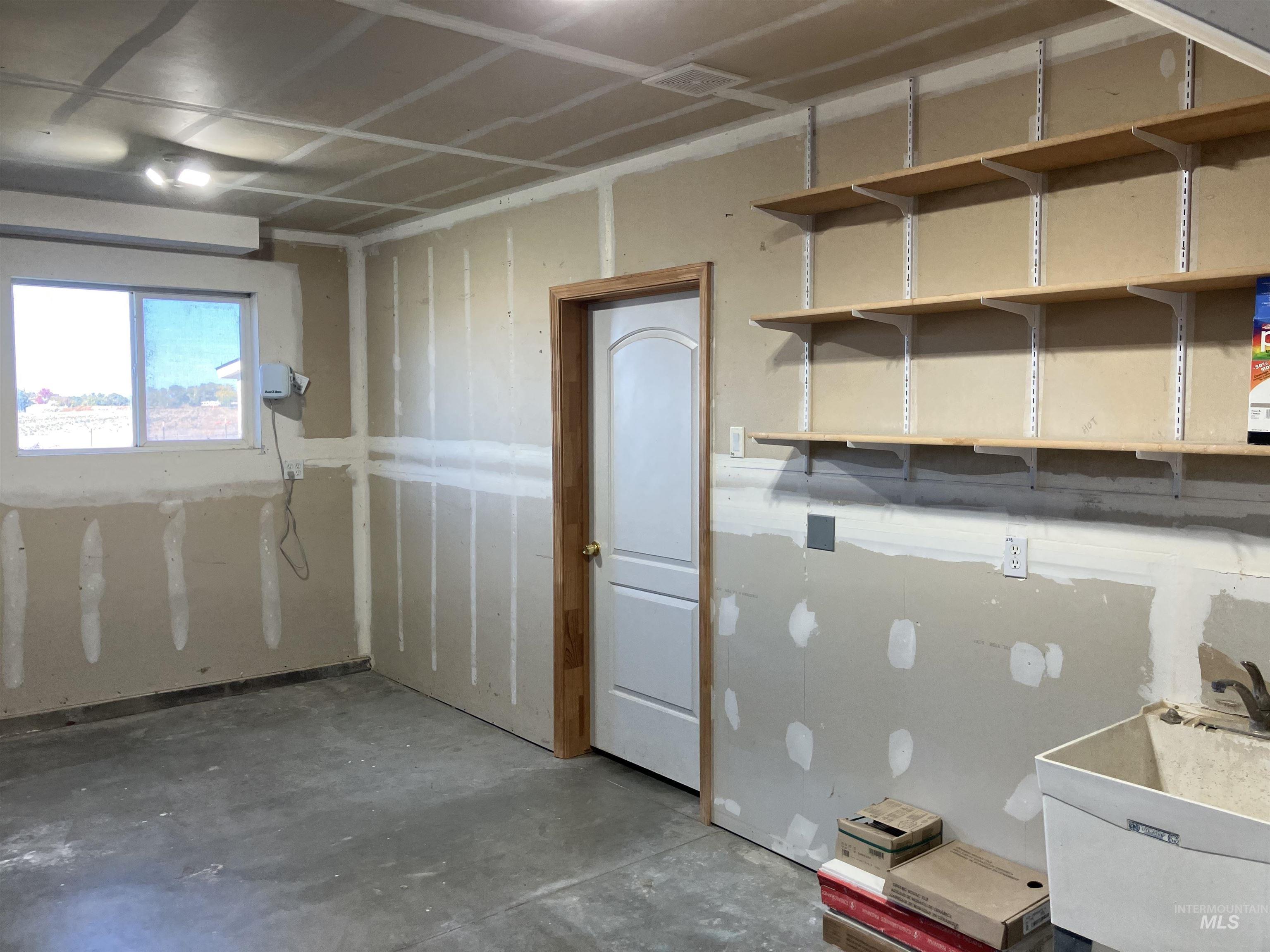 Garage featuring a sink
