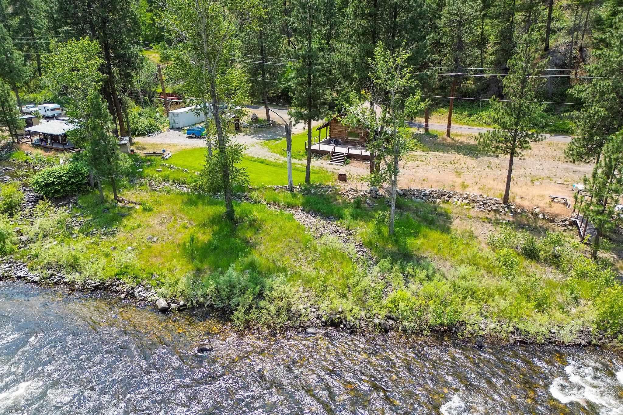 View of yard featuring a view of trees