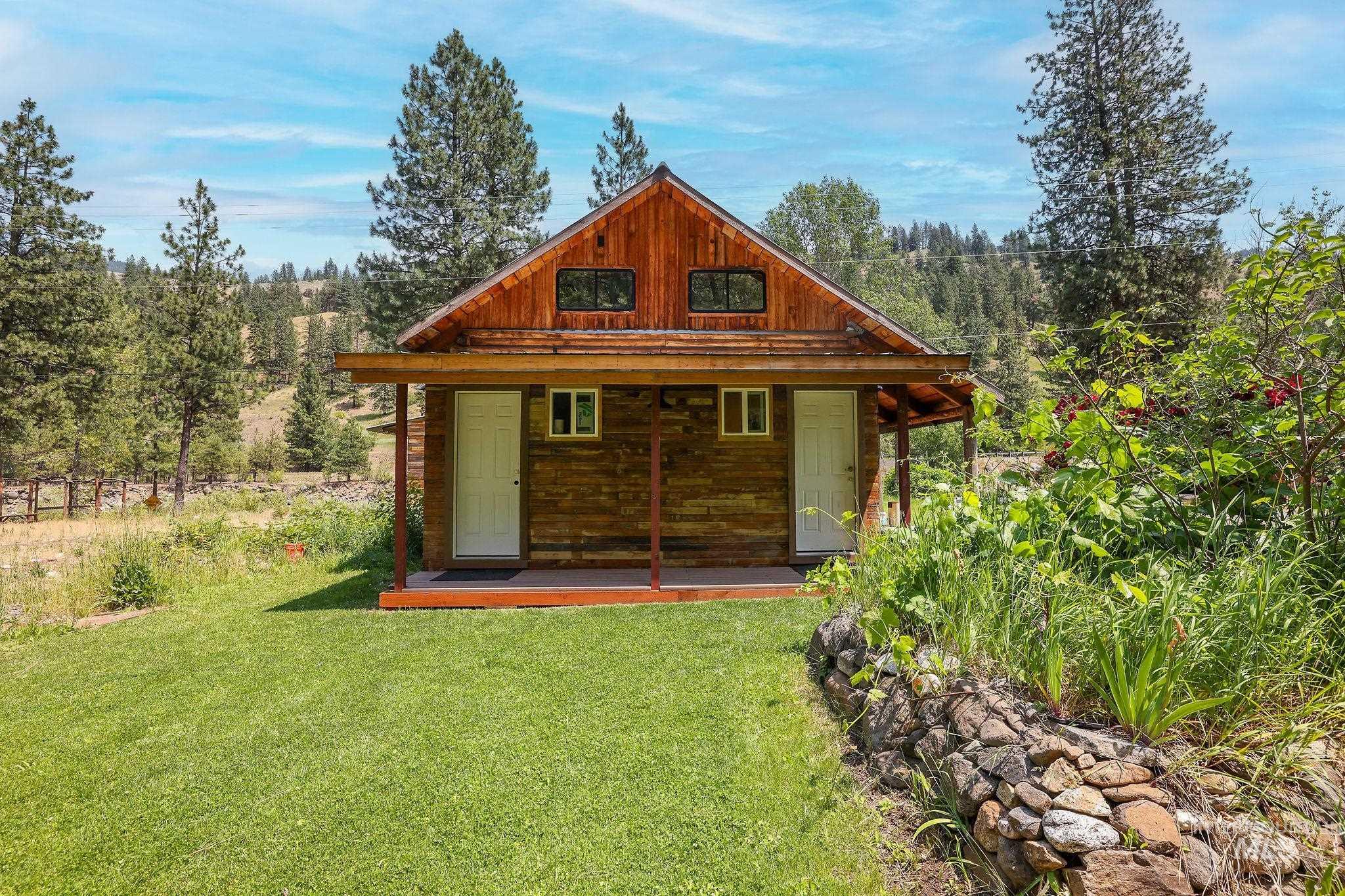 View of outbuilding with a forest view