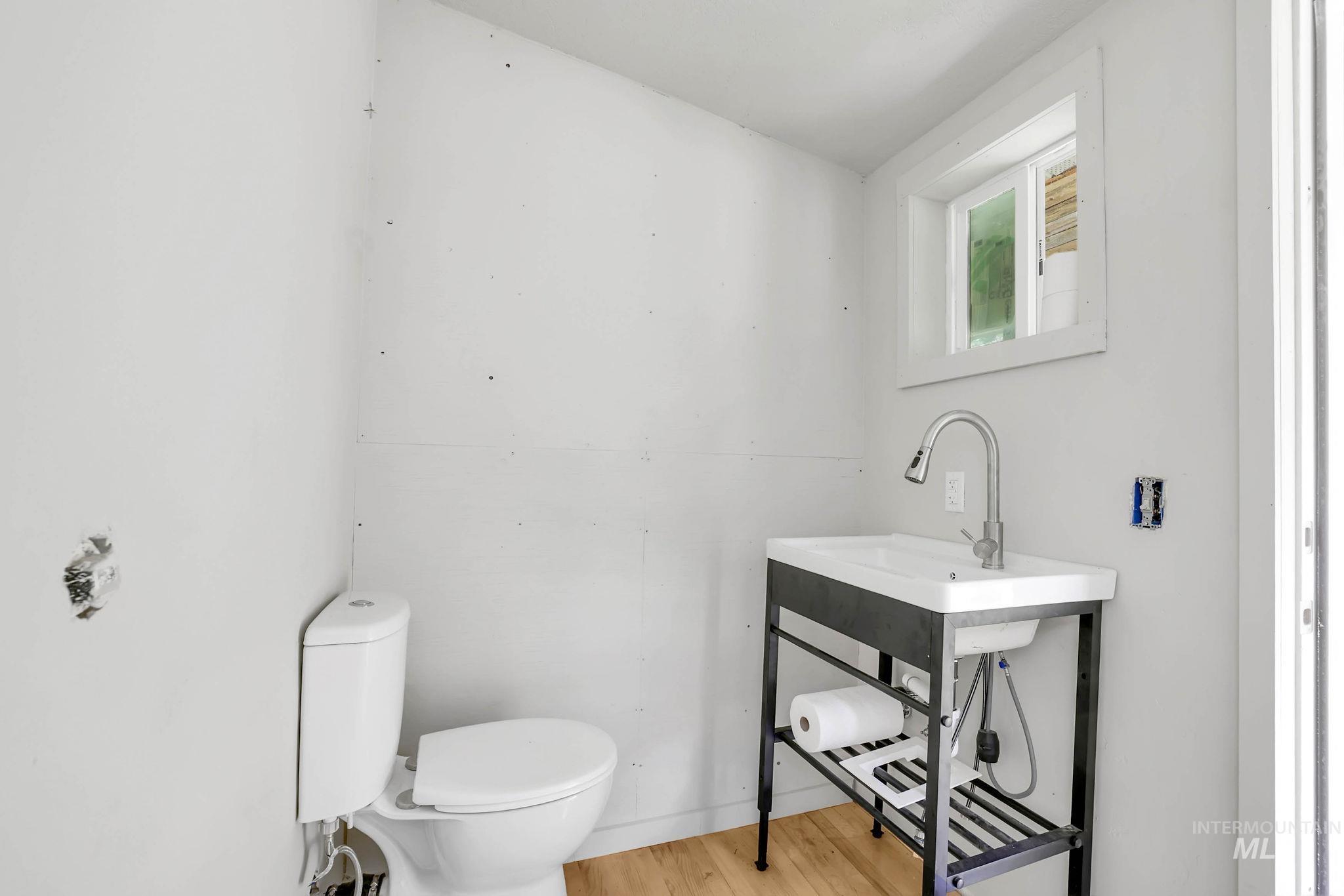 Bathroom with wood finished floors and vanity
