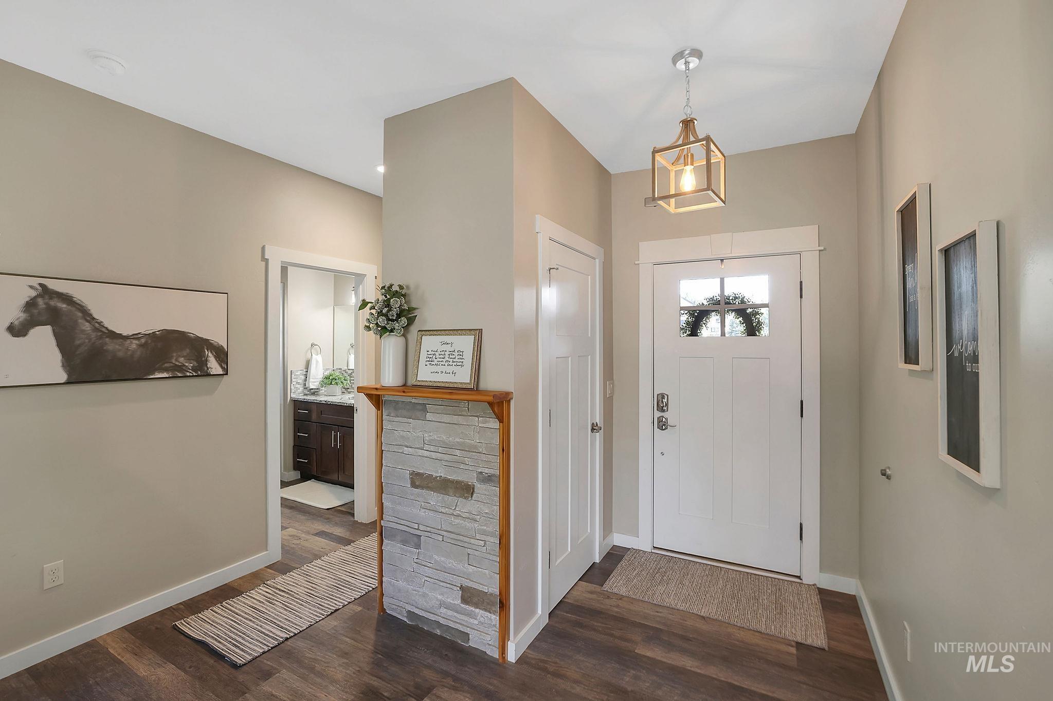 Entrance foyer with dark wood finished floors