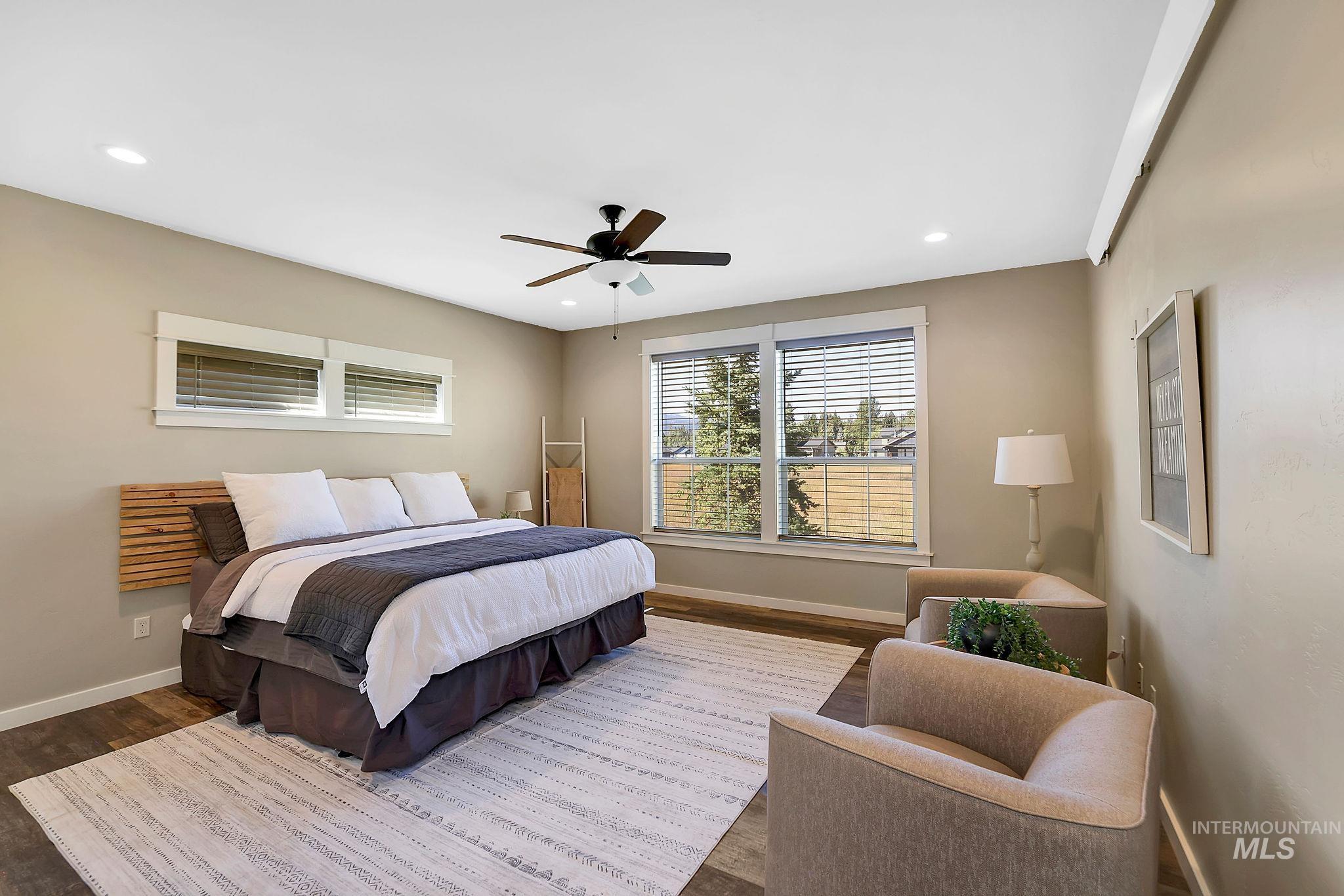 Bedroom with ceiling fan, wood finished floors, and recessed lighting