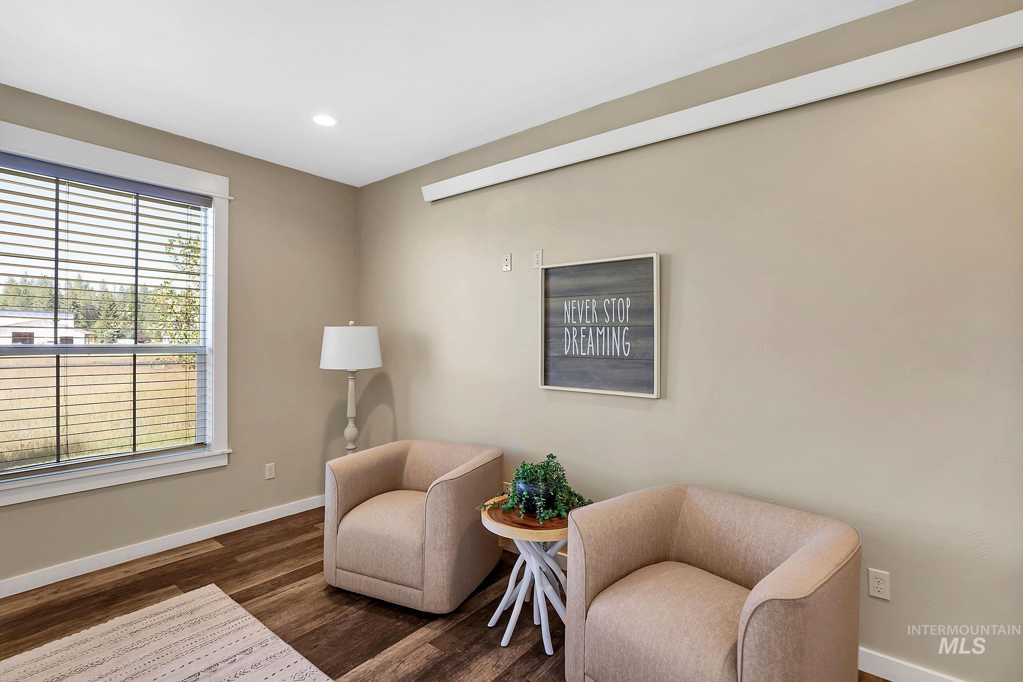 Sitting room featuring wood finished floors and recessed lighting