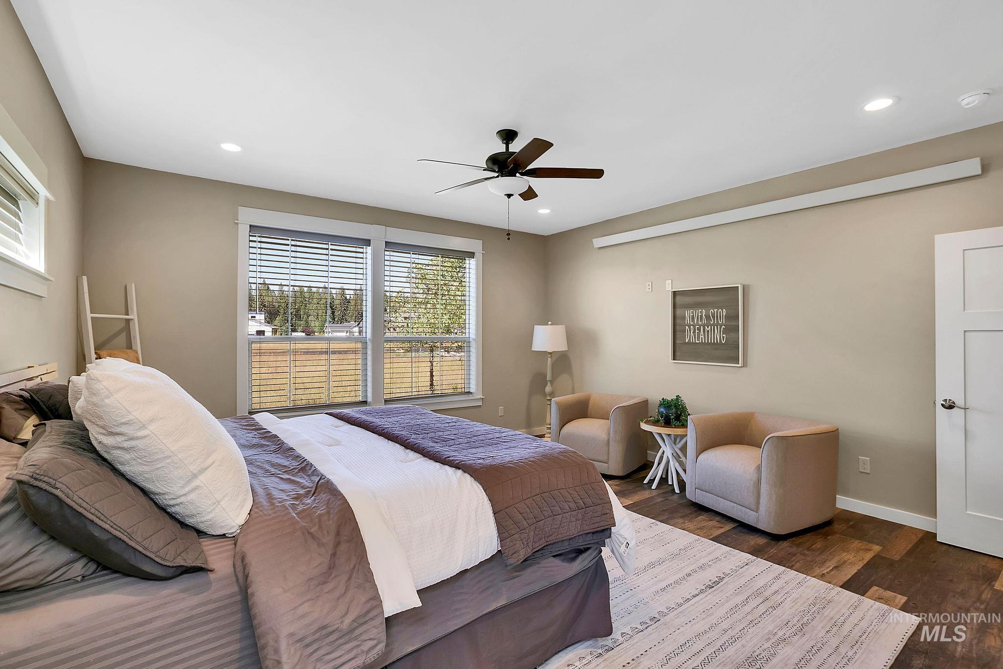 Bedroom featuring wood finished floors, ceiling fan, and recessed lighting
