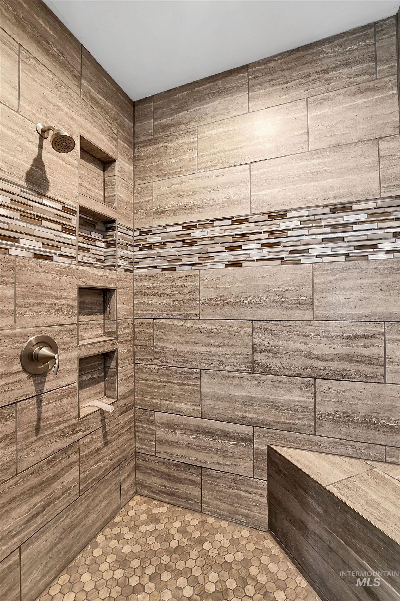 Bathroom featuring a tile shower