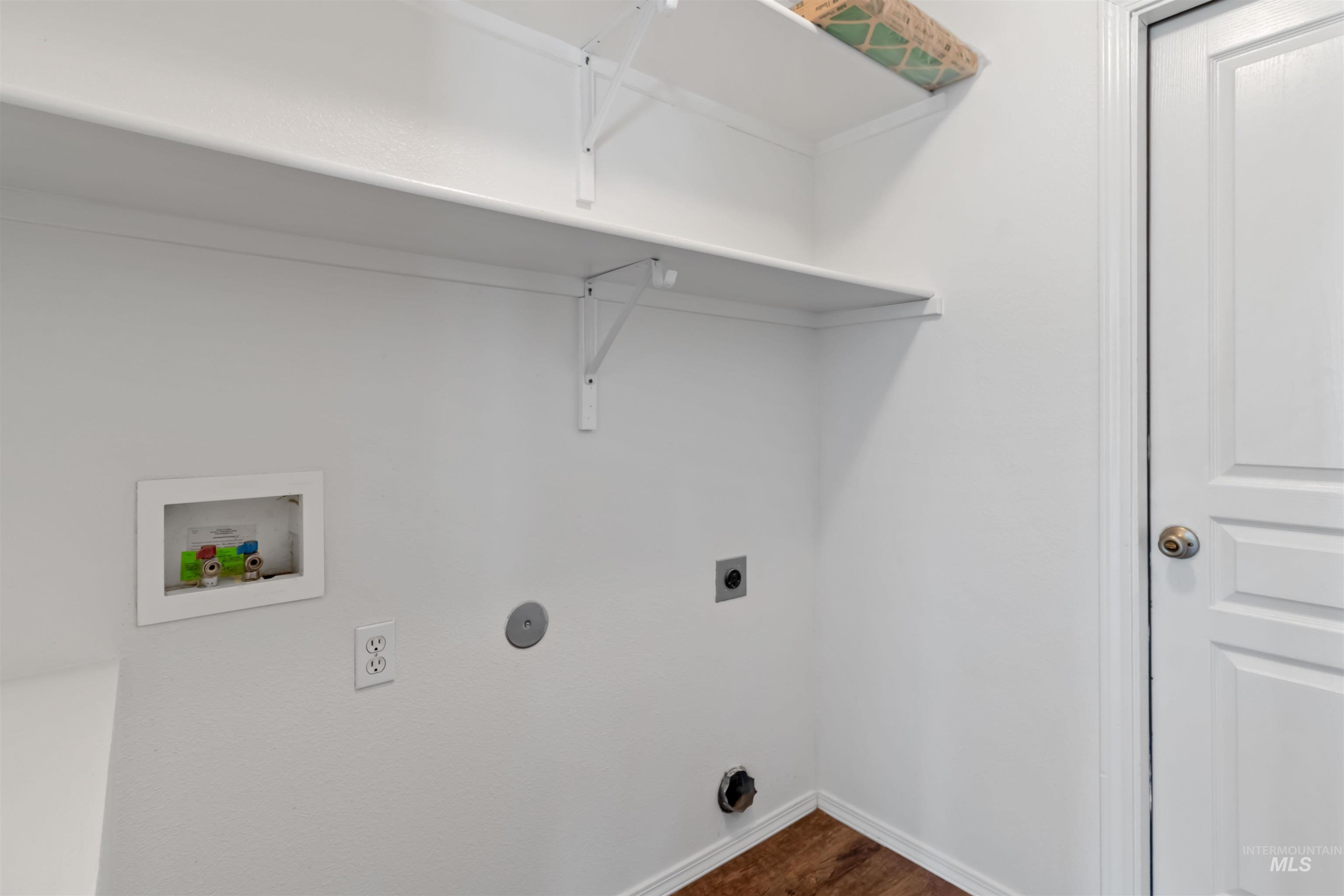 Laundry area featuring washer hookup, dark wood-style flooring, and electric dryer hookup
