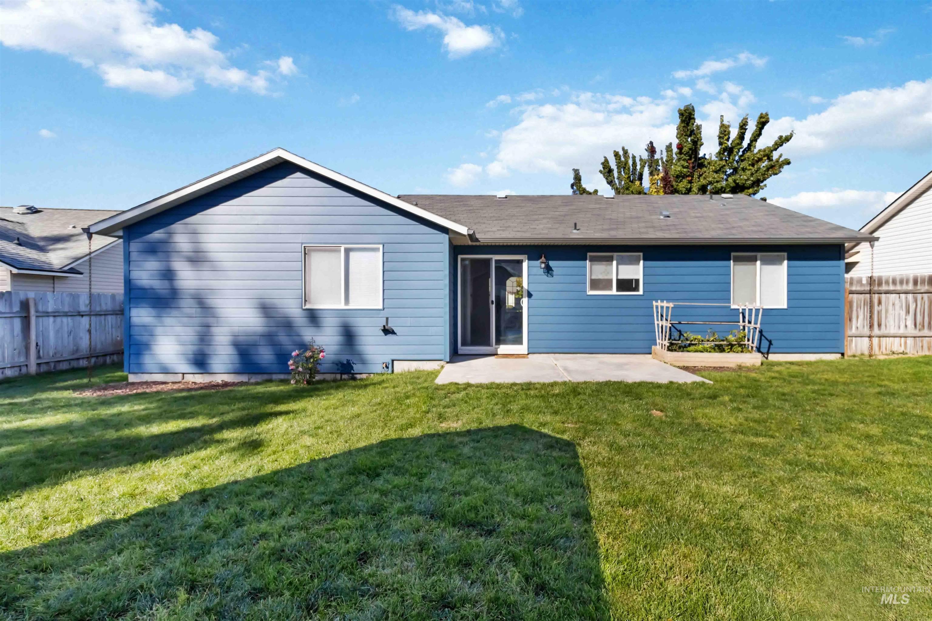 Back of property featuring a patio area and a fenced backyard