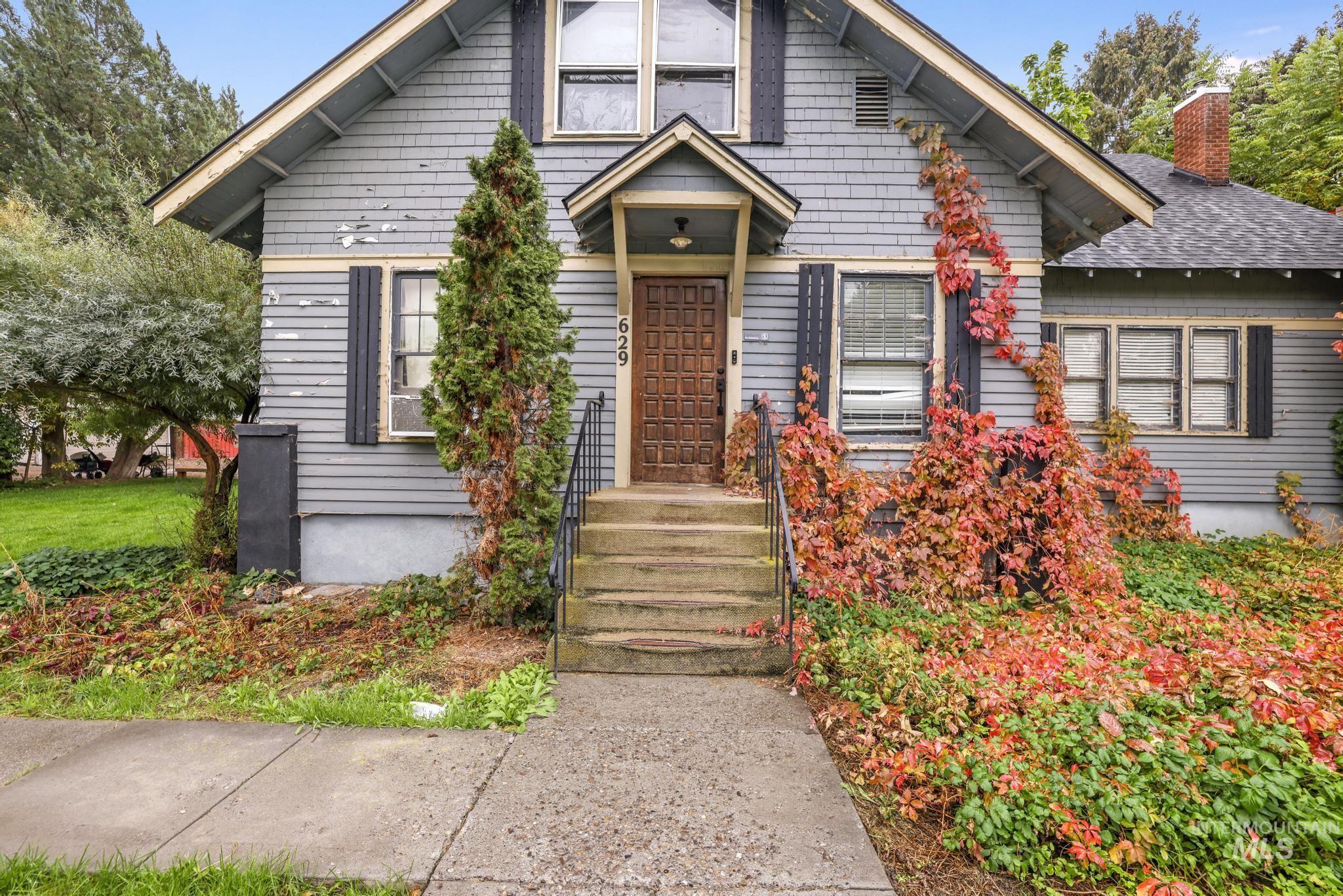 Bungalow-style home featuring a chimney