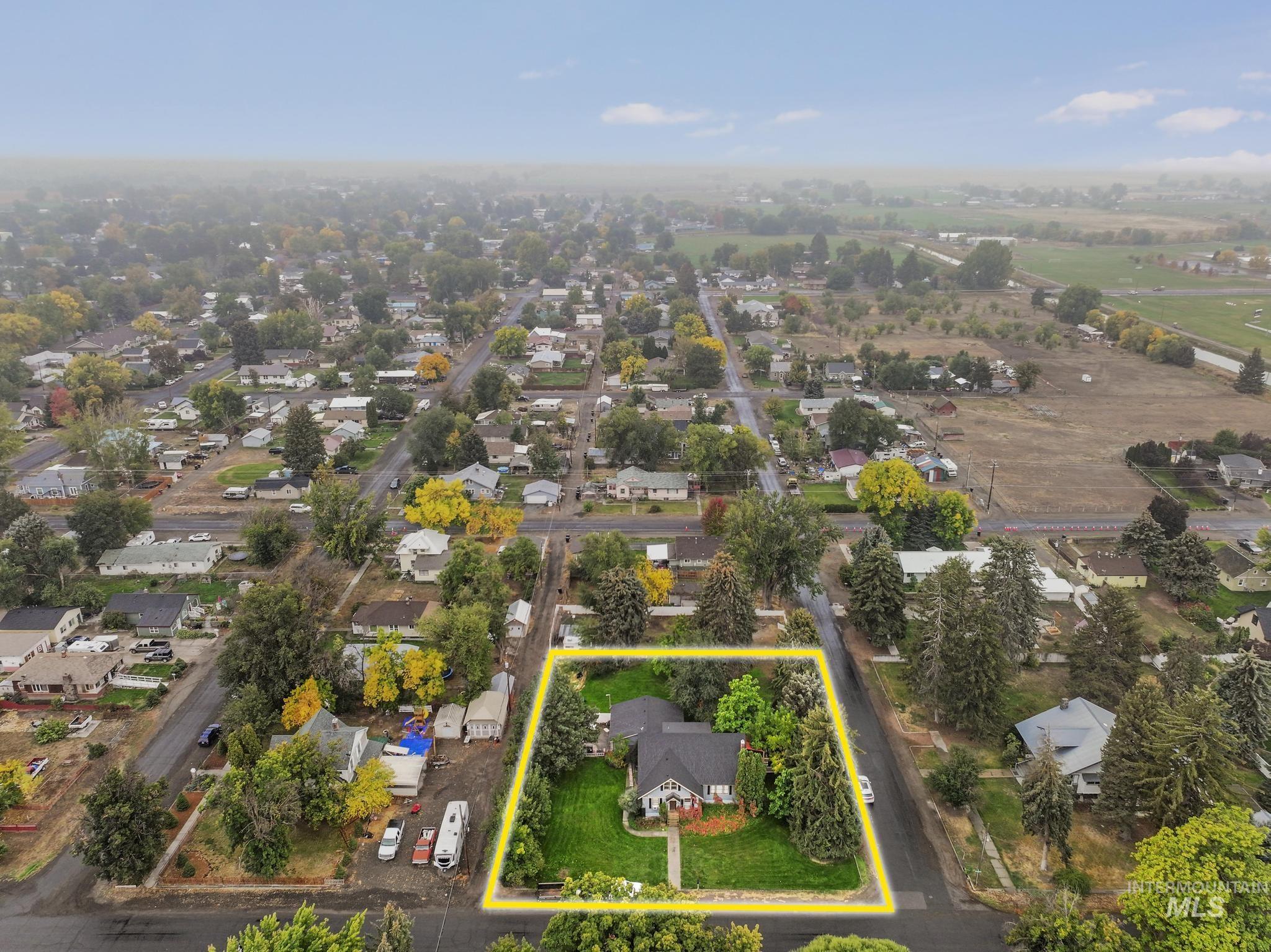Aerial perspective of suburban area with property parcel outlined