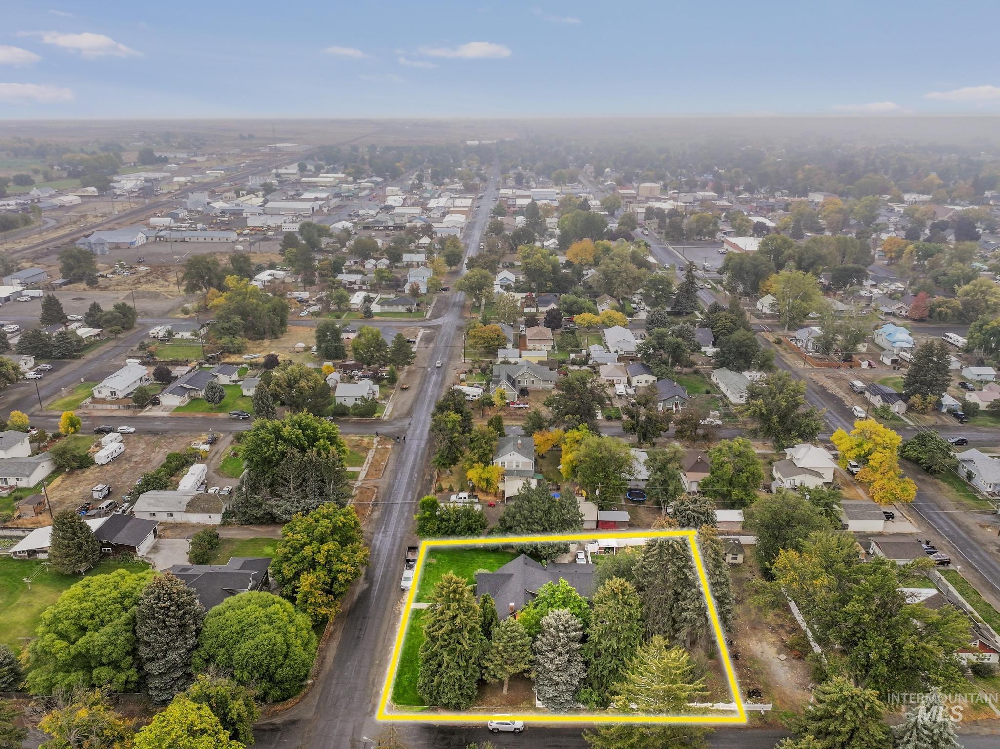 Aerial perspective of suburban area featuring property boundaries highlighted