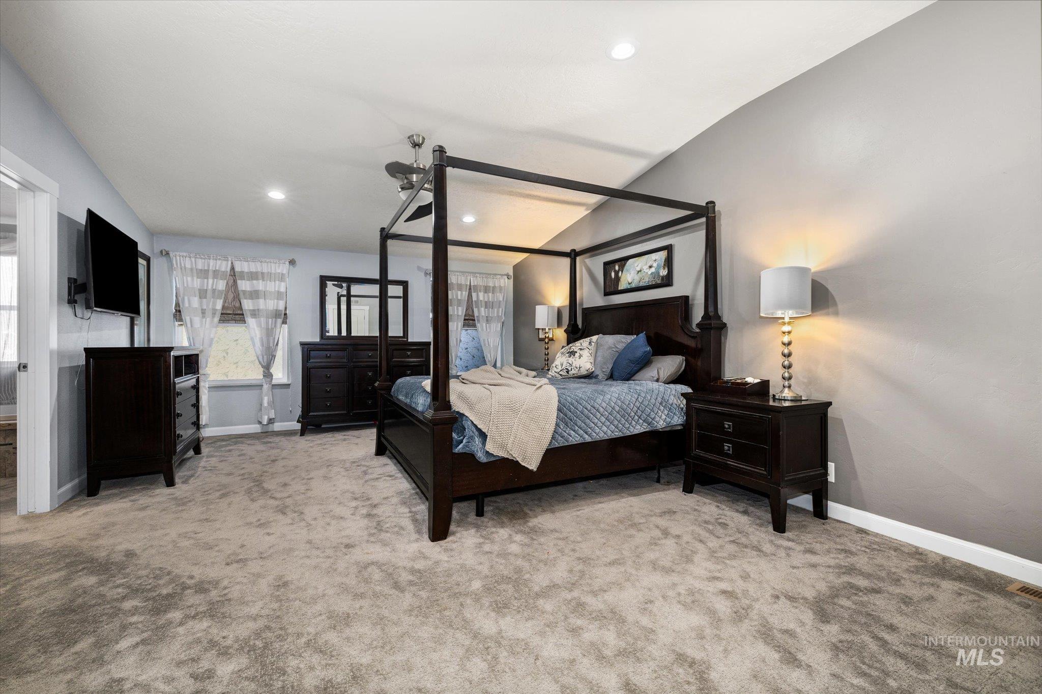 Bedroom featuring light carpet and recessed lighting