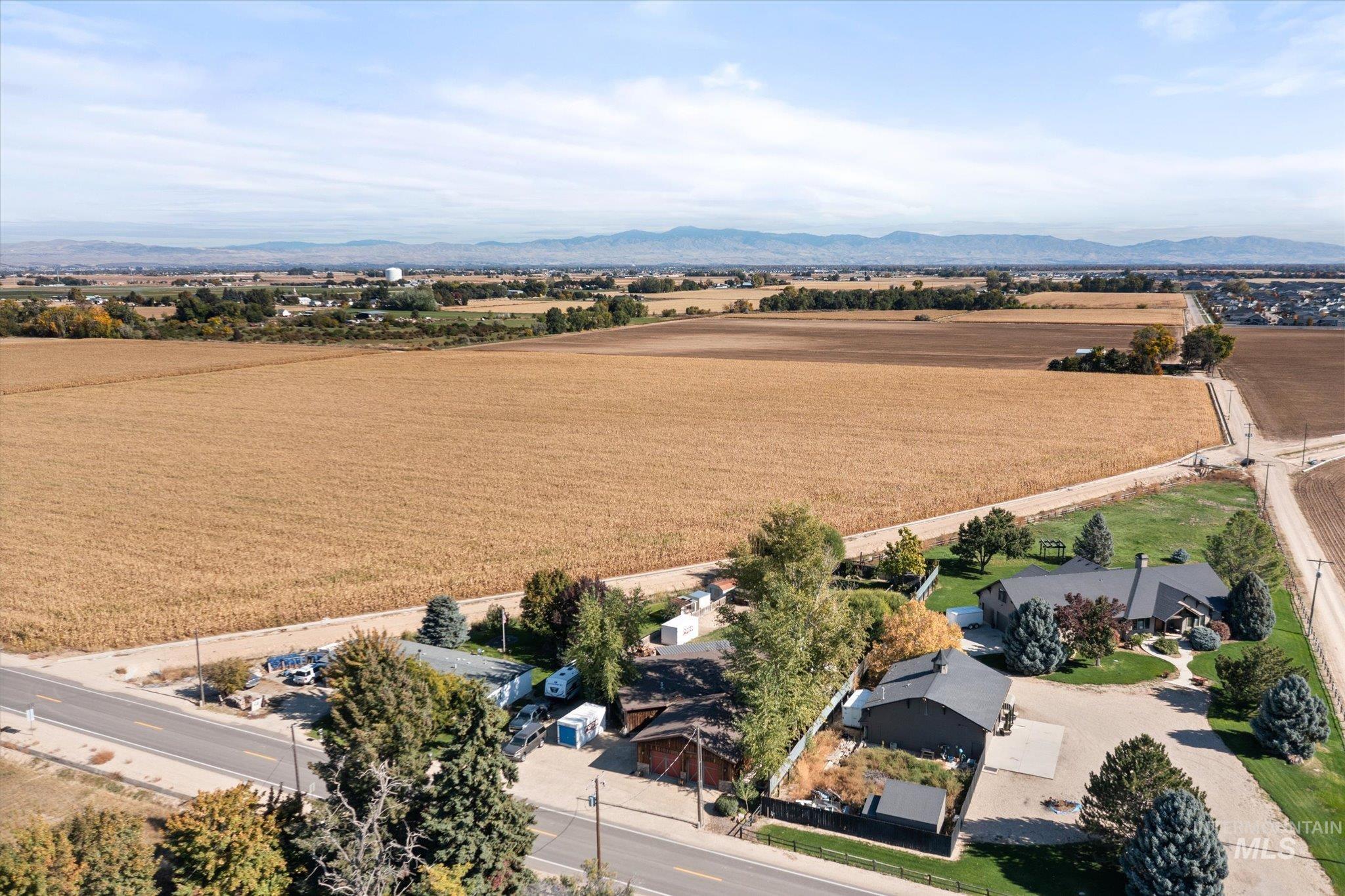 Overview of rural landscape with a mountain backdrop and abundant farmland