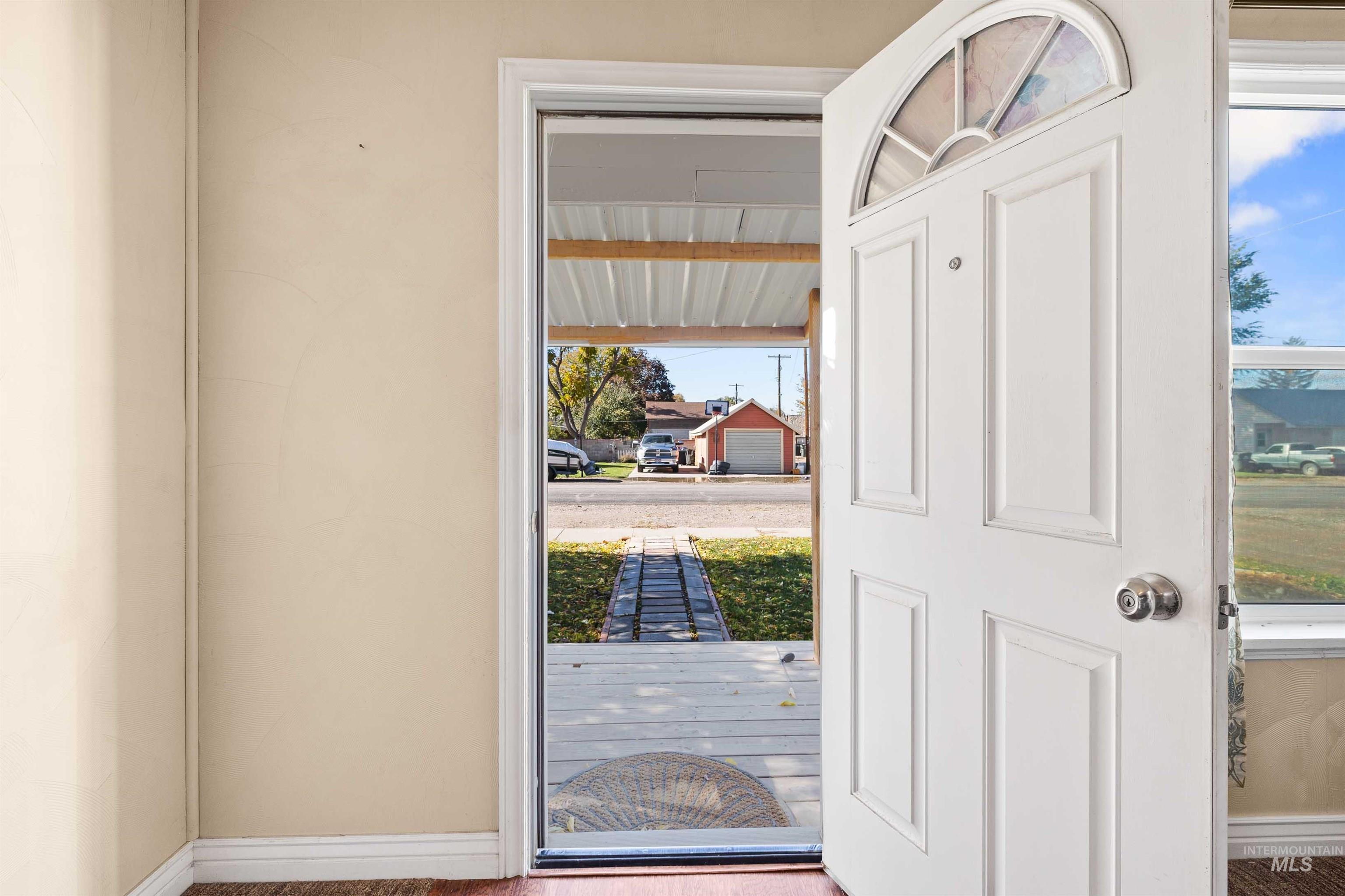 Entryway featuring wood finished floors and healthy amount of natural light