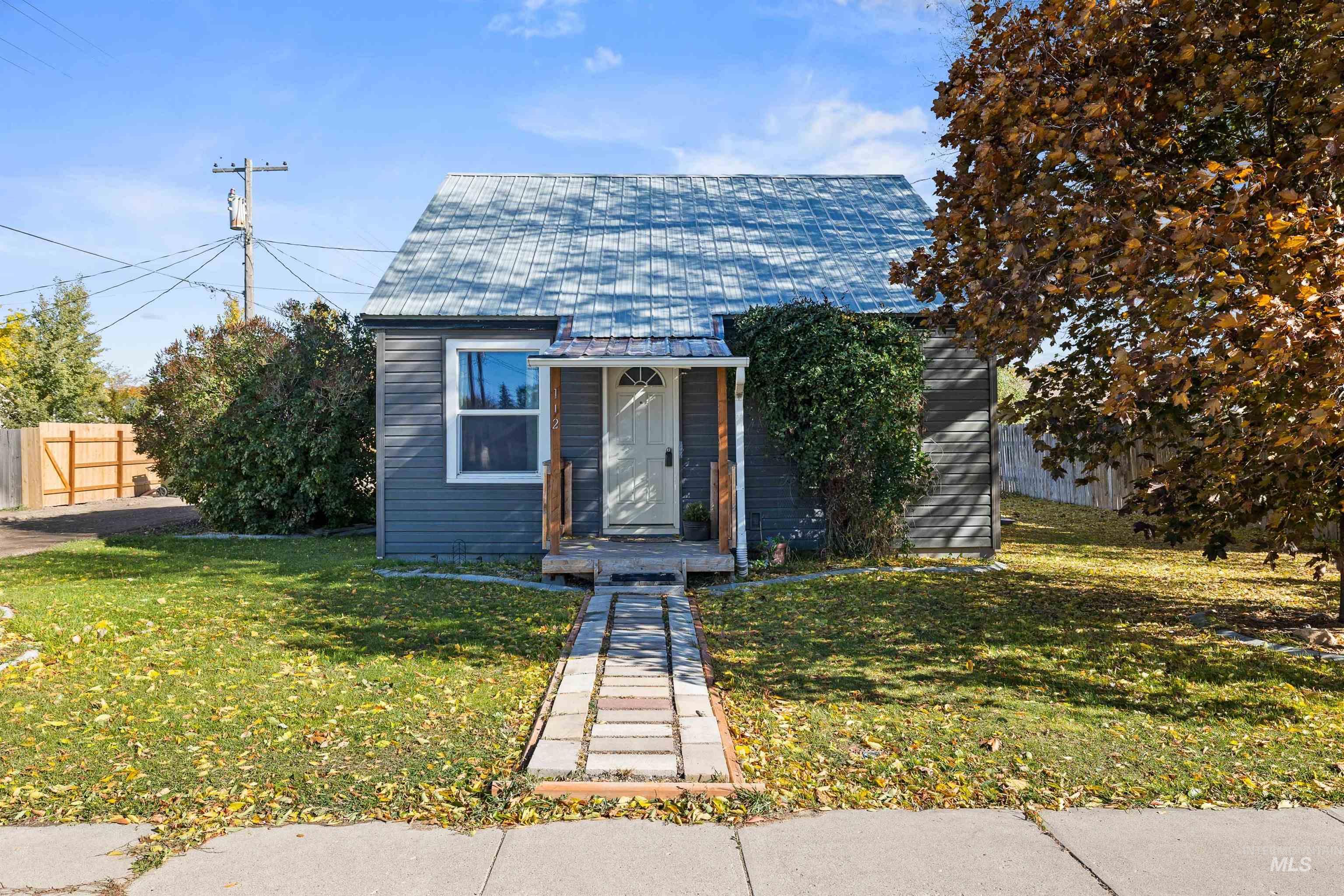 Bungalow-style house featuring a metal roof