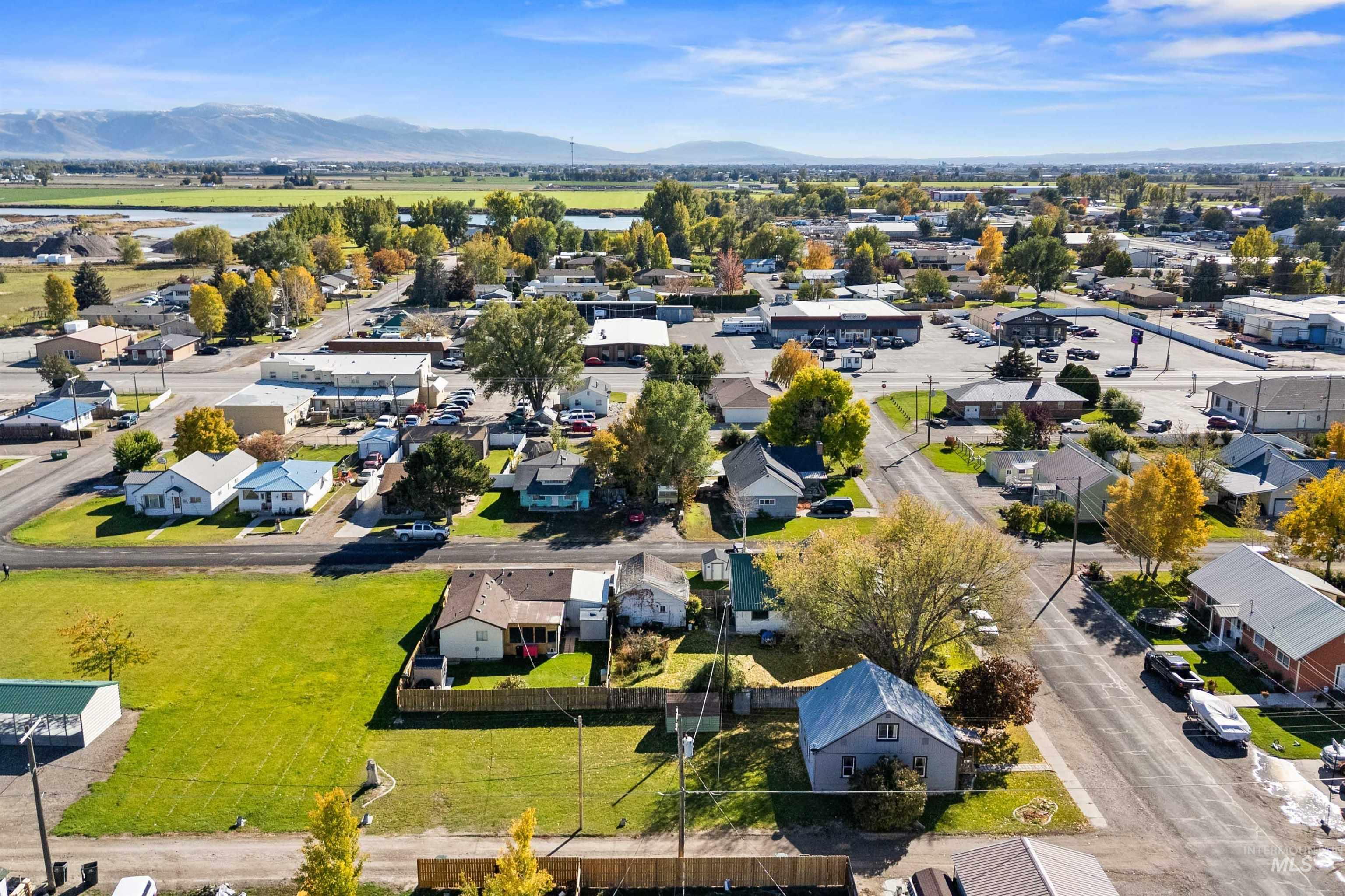 Aerial view of residential area featuring a mountain backdrop