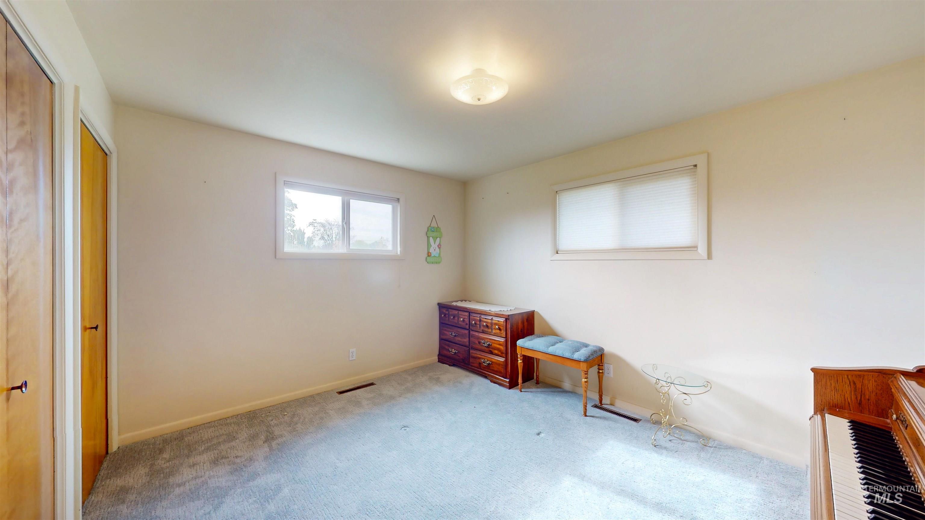 Bedroom with carpet and a closet