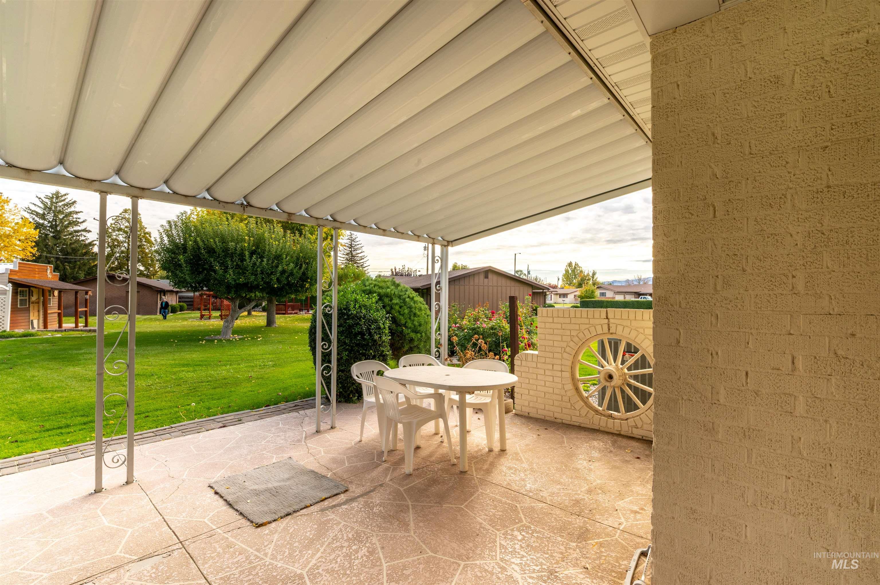 View of patio with outdoor dining area
