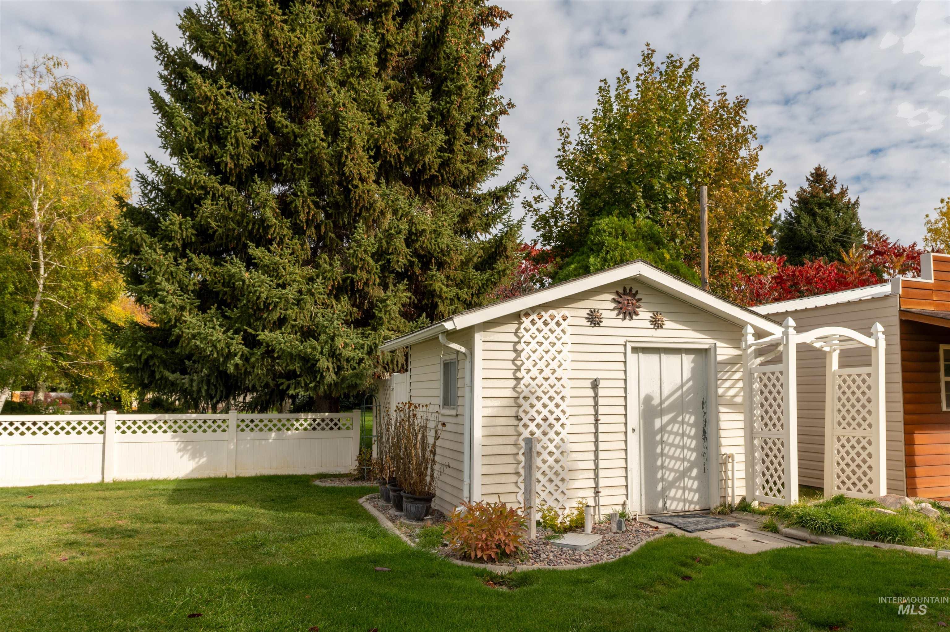 View of shed featuring view of scattered trees