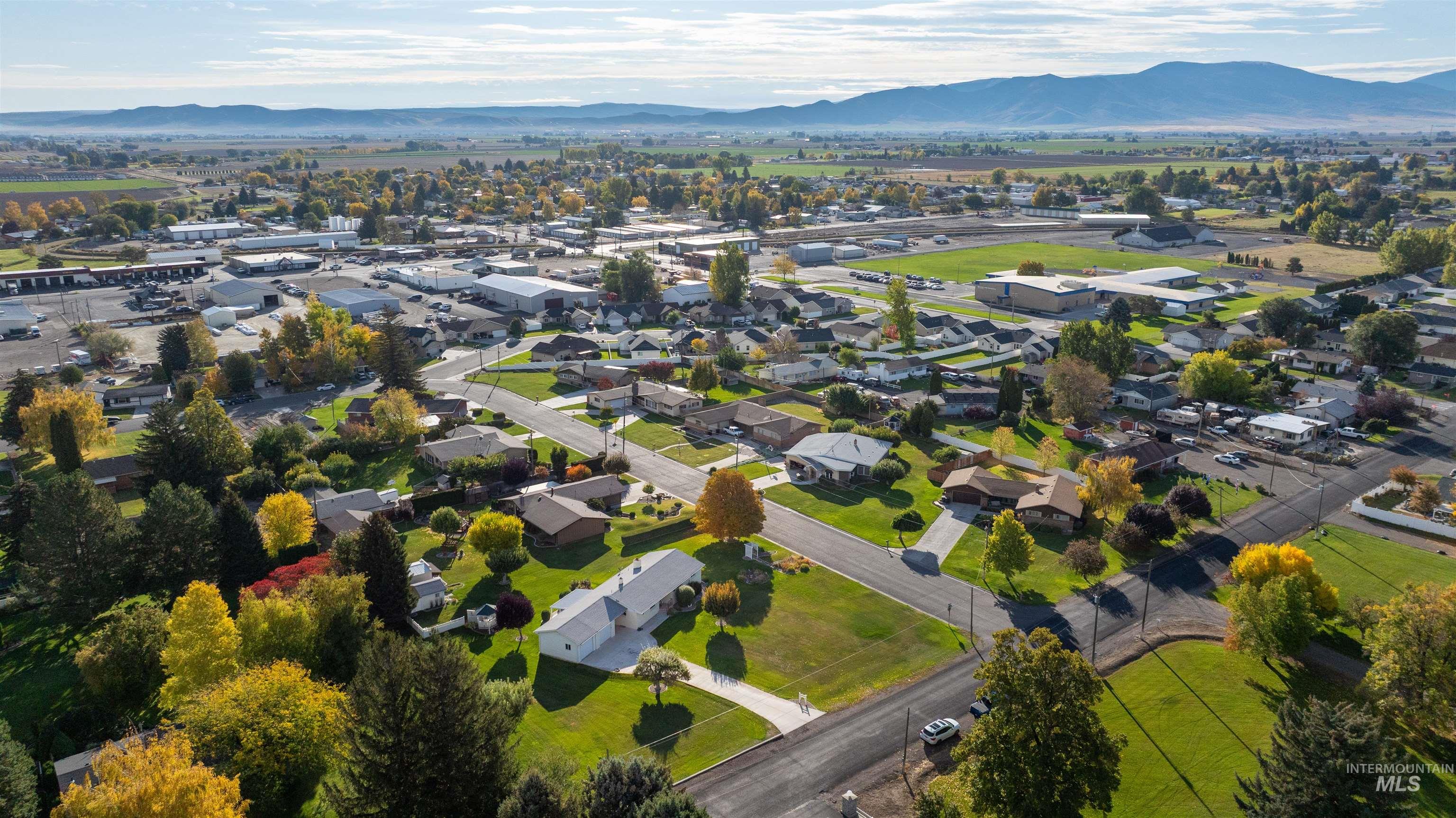 View of property location featuring a mountainous background and nearby suburban area