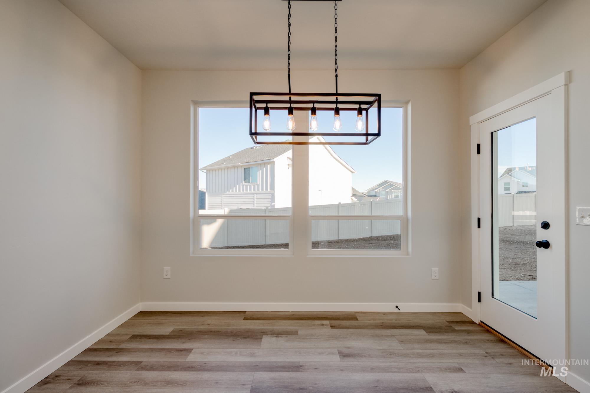 Unfurnished dining area featuring light wood-style floors