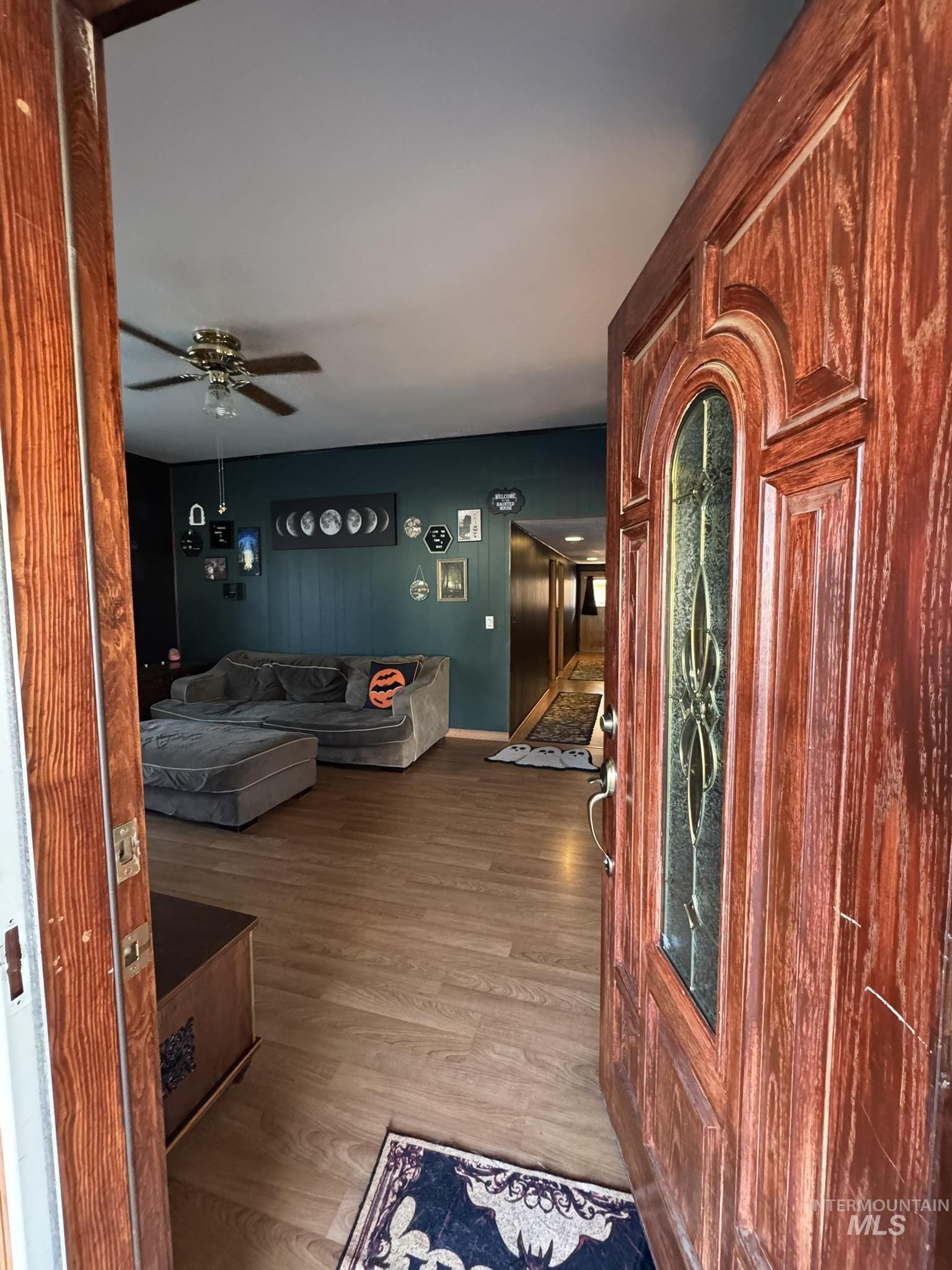 Interior space featuring light wood finished floors and ceiling fan