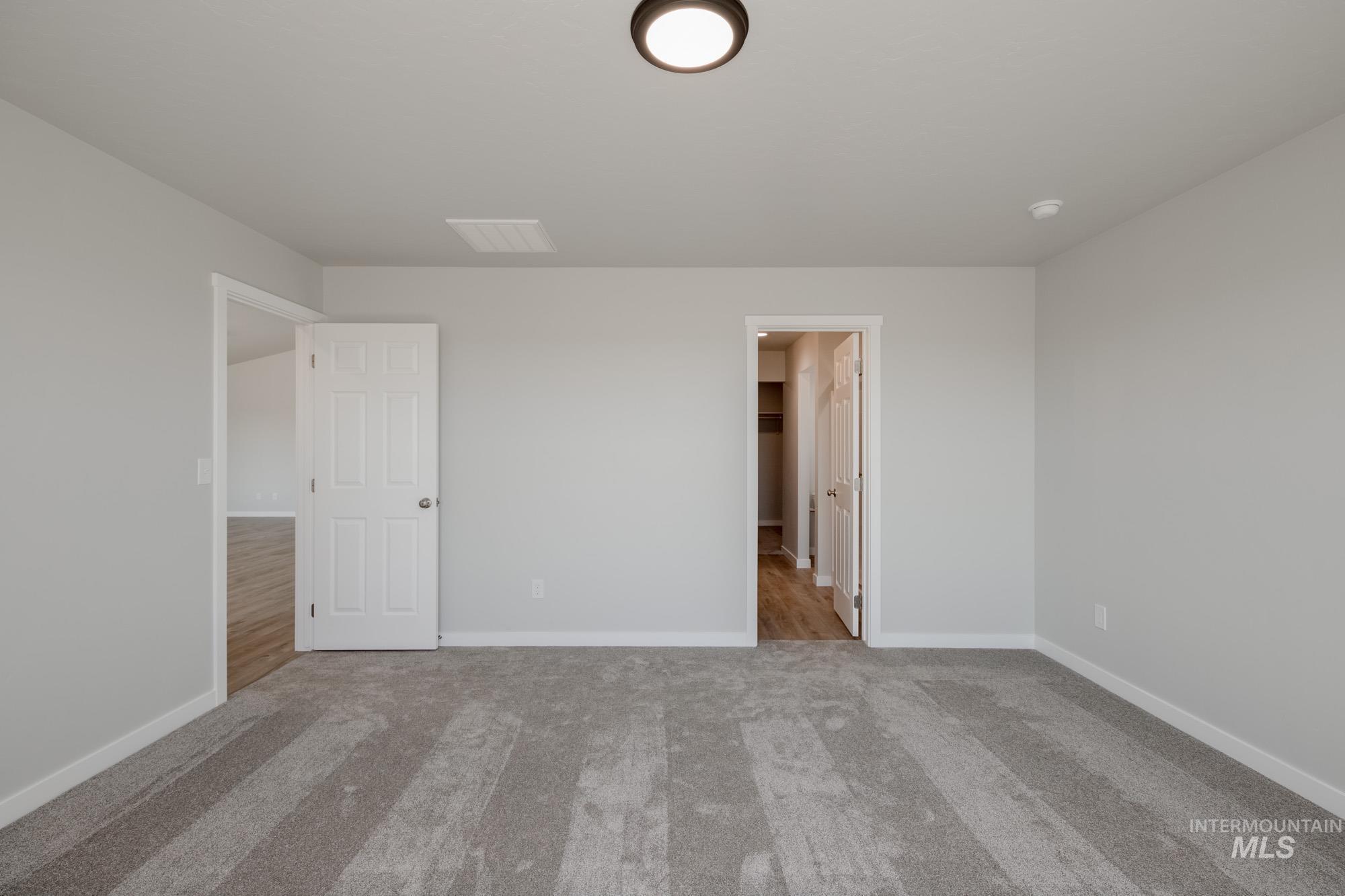 Unfurnished bedroom featuring carpet flooring