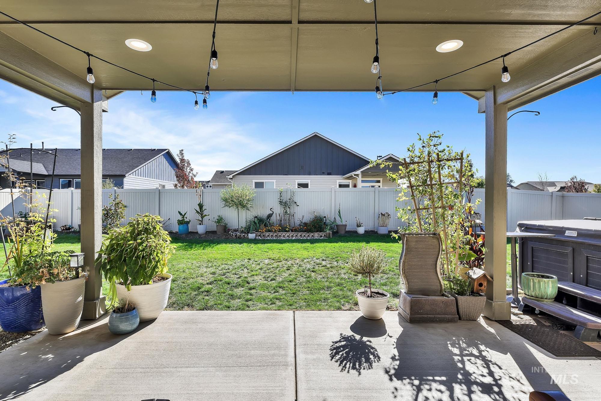 Fenced backyard with a patio area