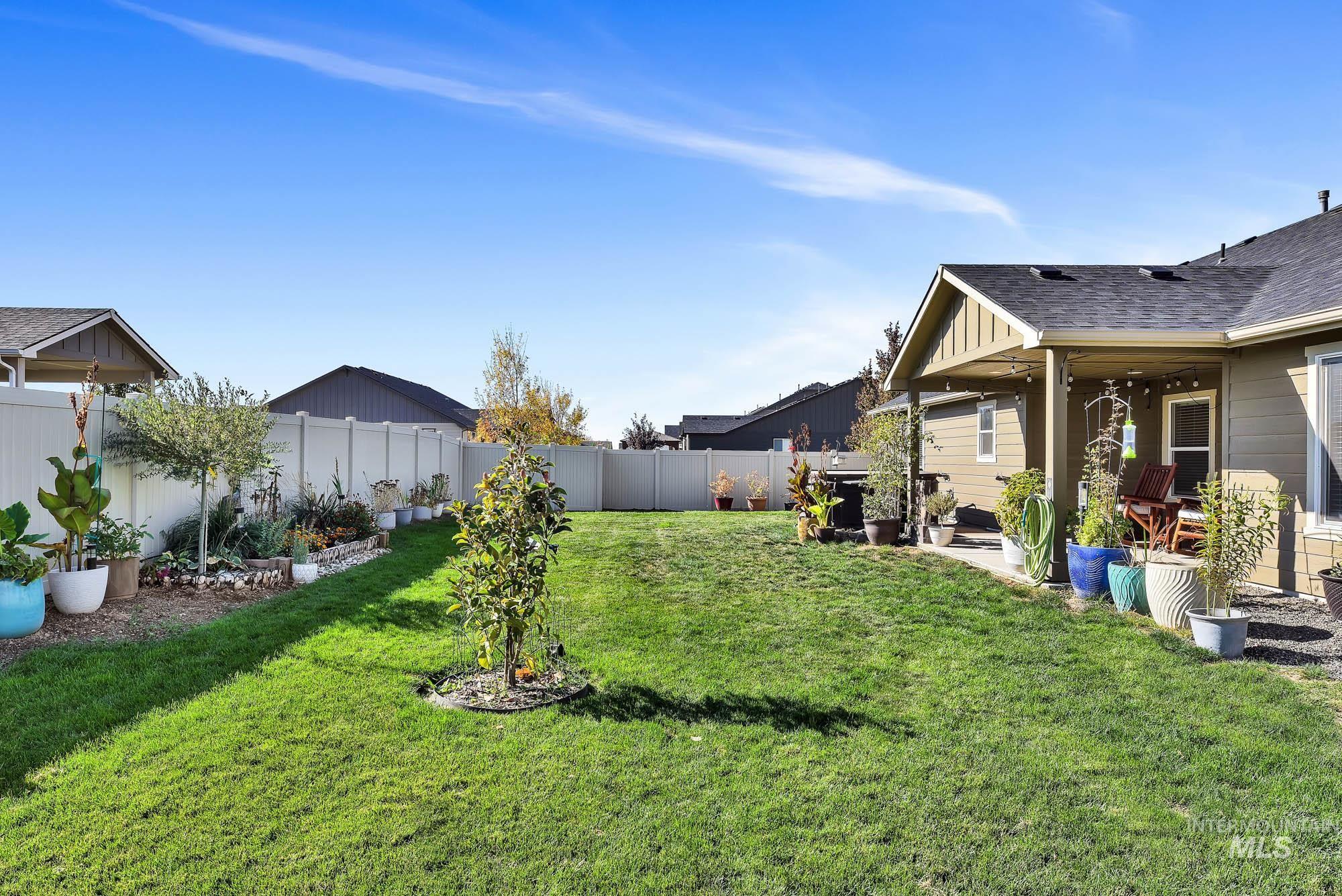 Fenced backyard with a patio area