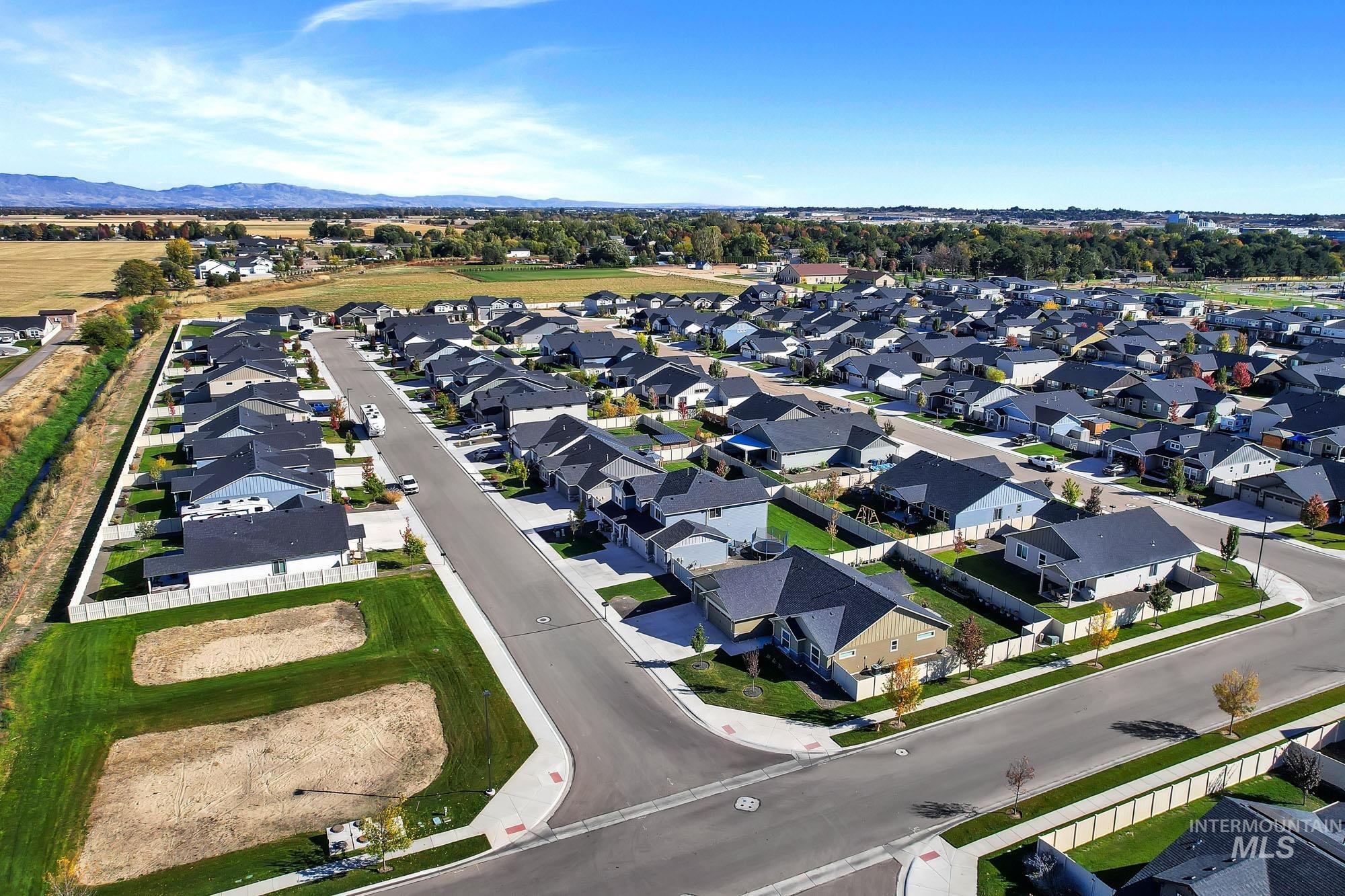 View of property location with nearby suburban area and a mountain backdrop
