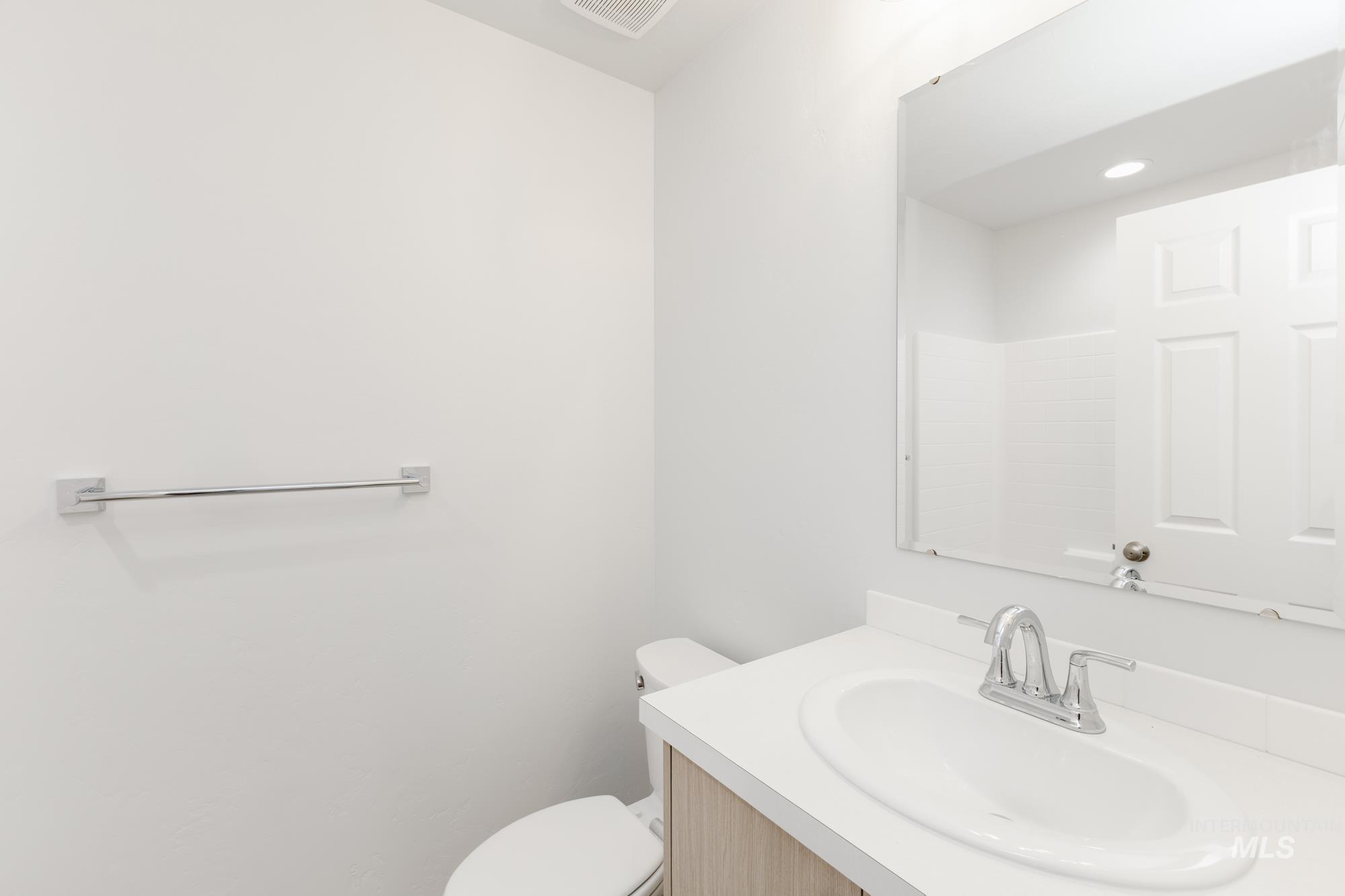 Bathroom with vanity and toilet