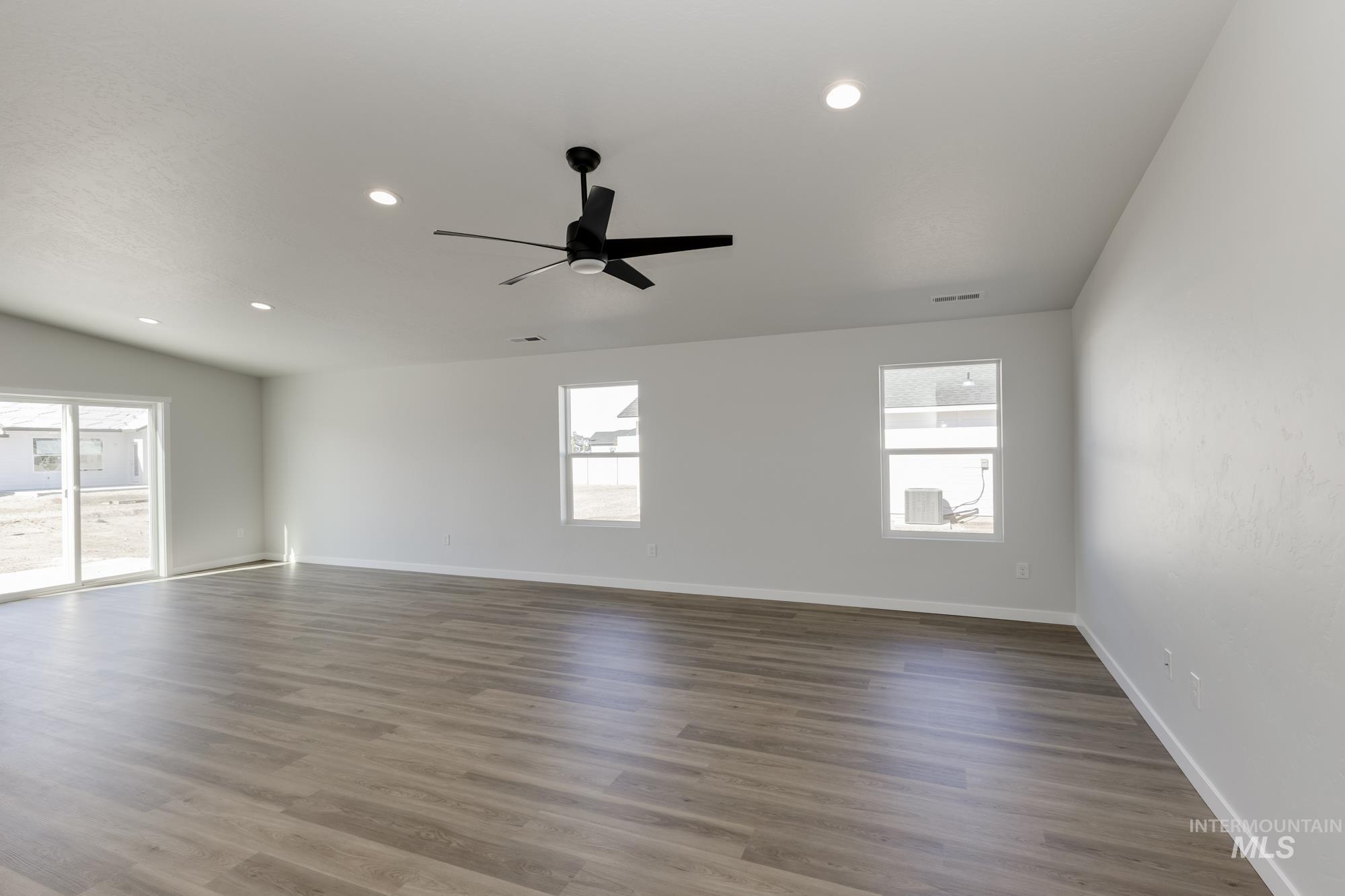 Empty room featuring light wood finished floors, recessed lighting, and ceiling fan