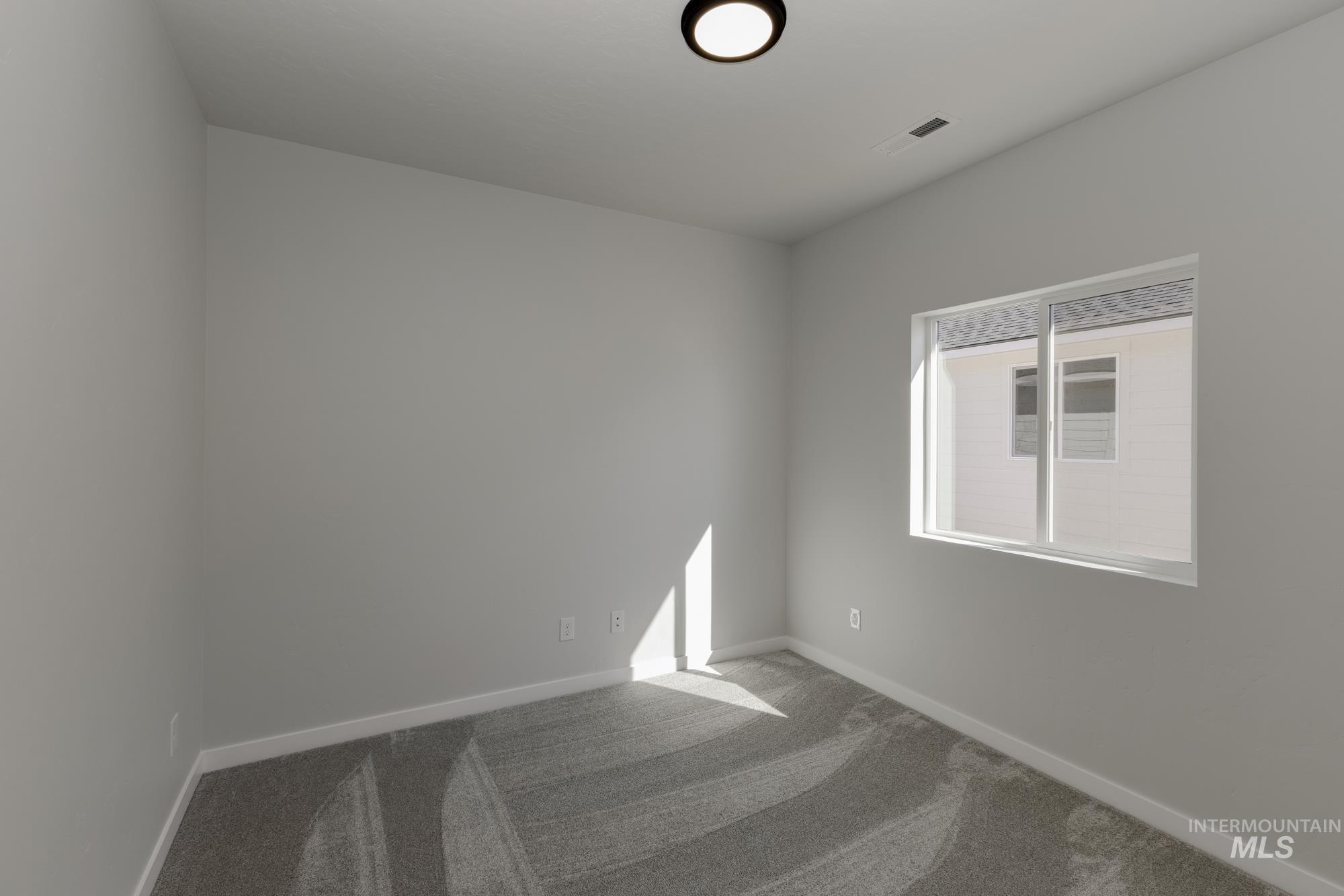 Unfurnished room featuring carpet floors