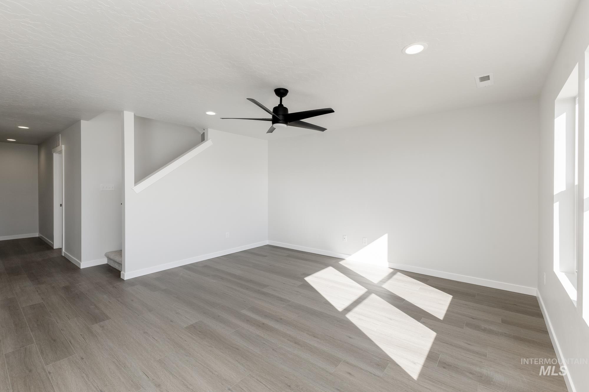 Unfurnished room featuring light wood-style flooring, recessed lighting, and ceiling fan