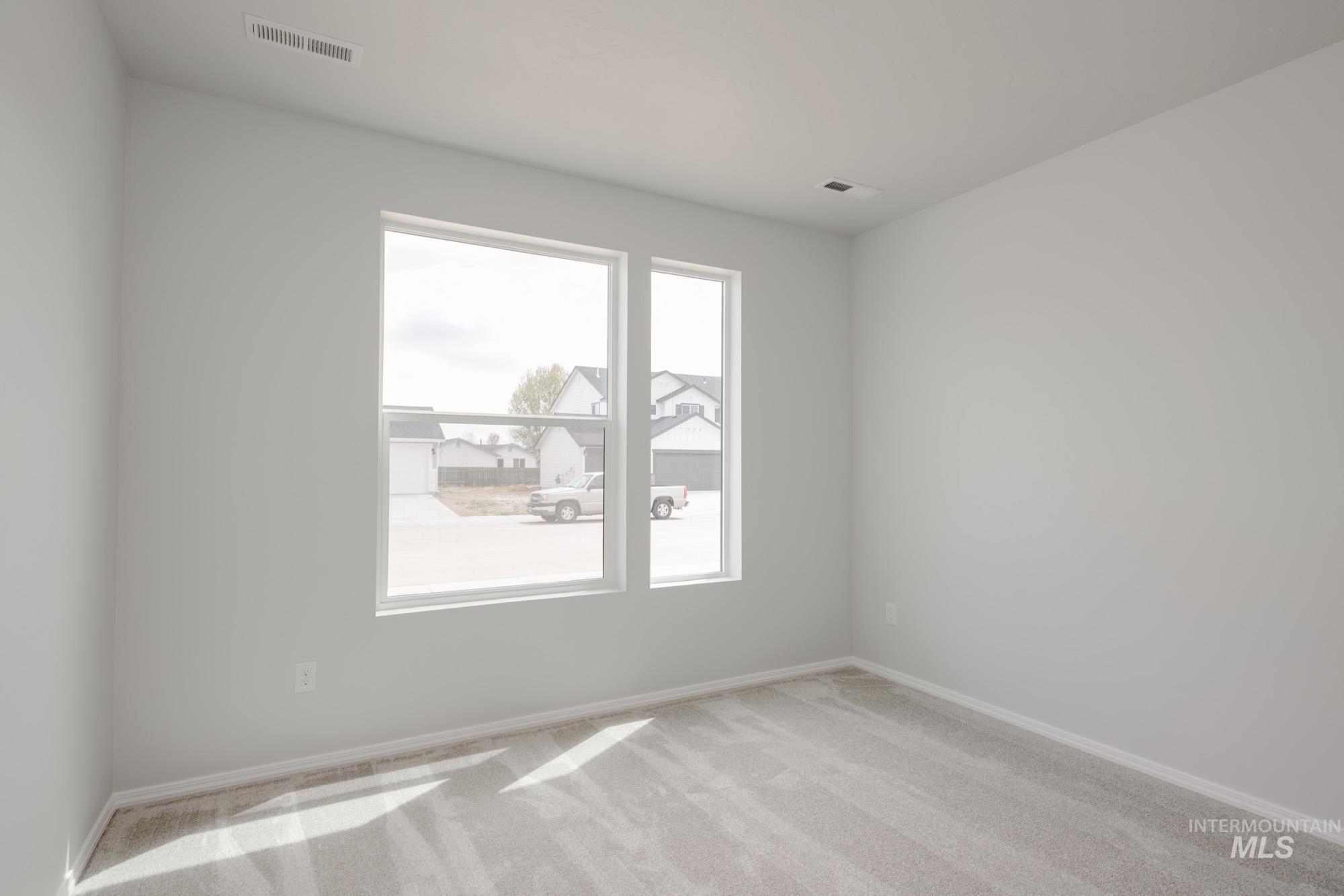Empty room featuring carpet floors