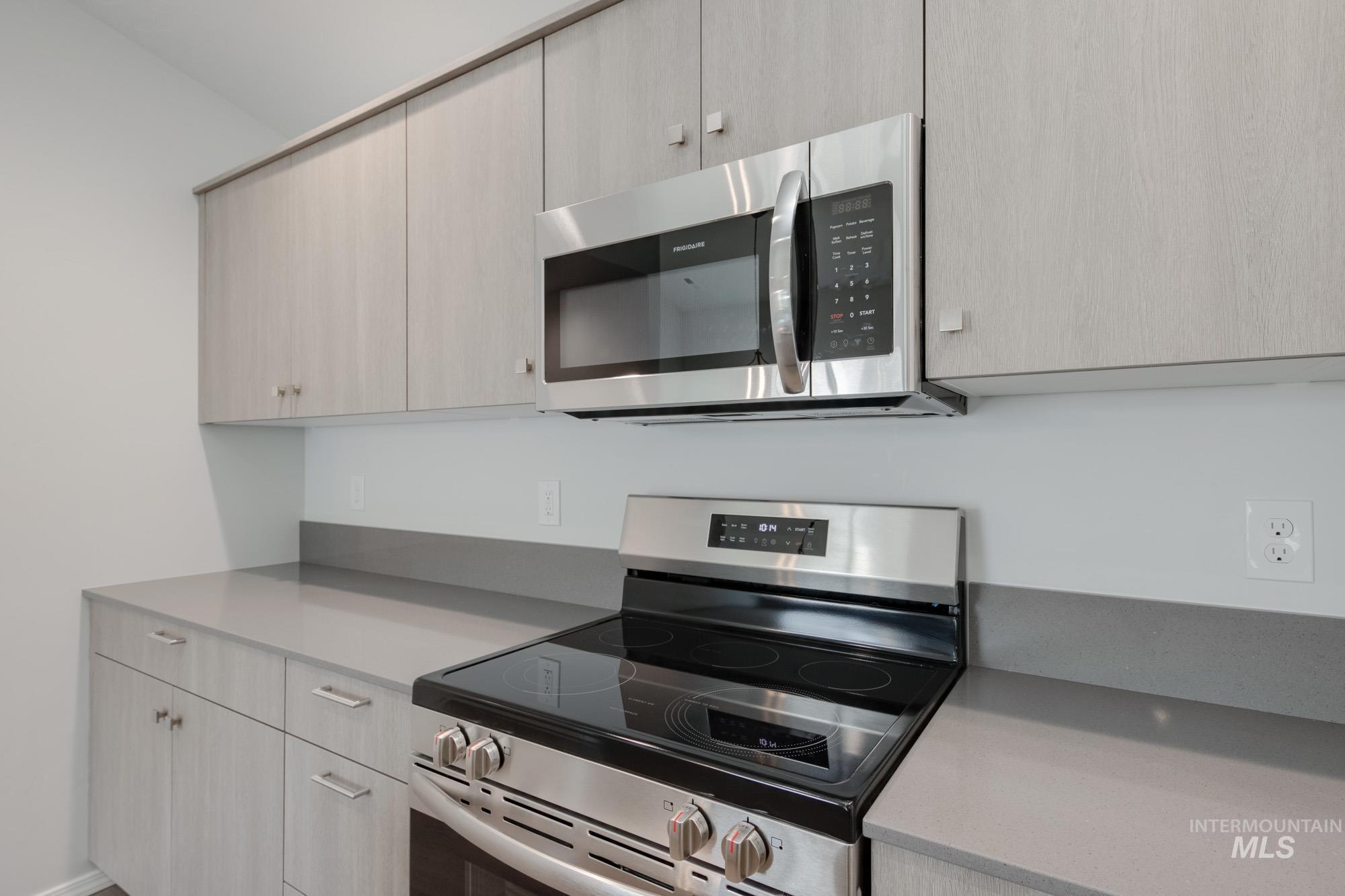 Kitchen with stainless steel appliances and modern cabinets