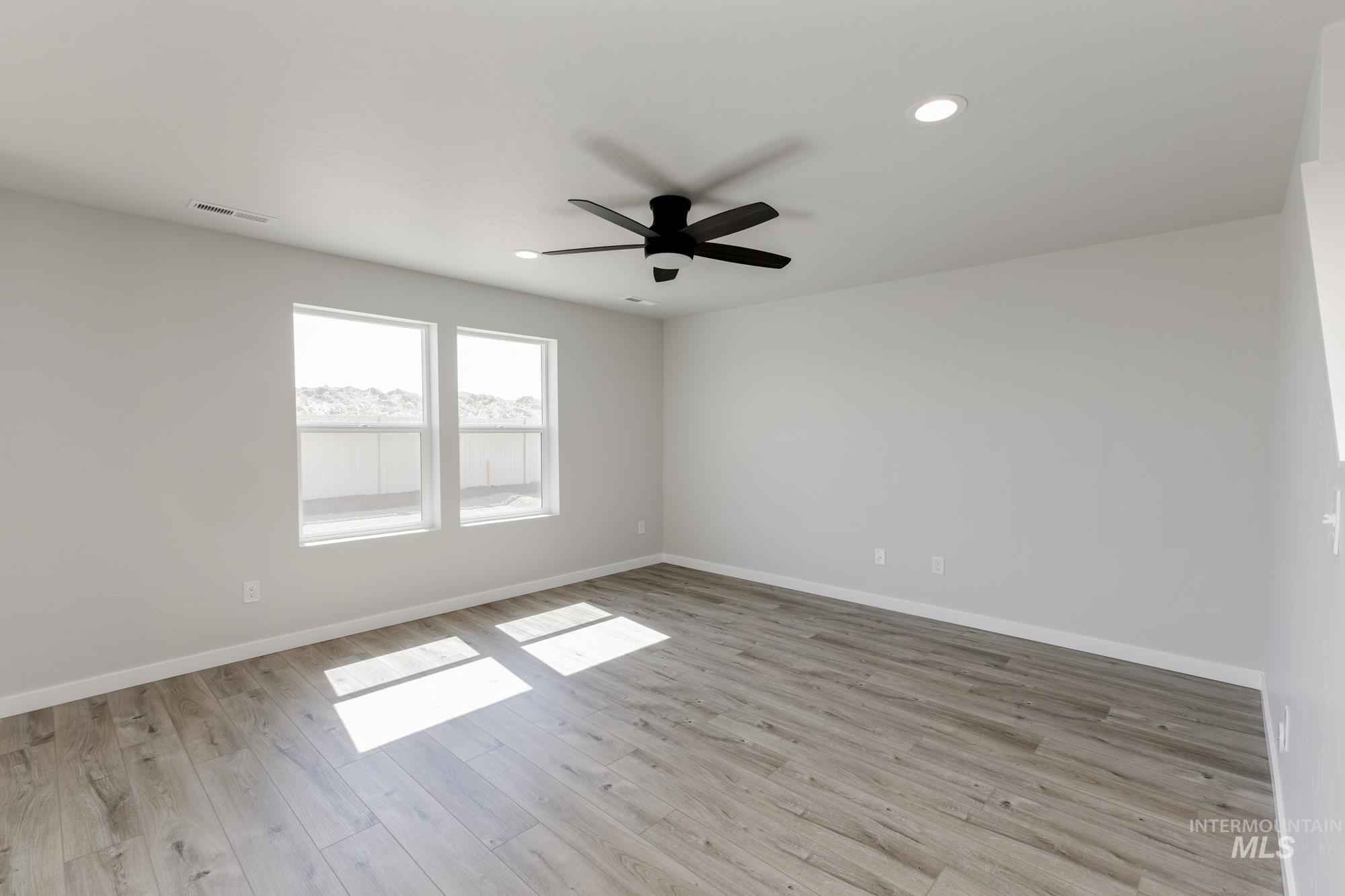 Unfurnished room with light wood-type flooring, recessed lighting, and ceiling fan