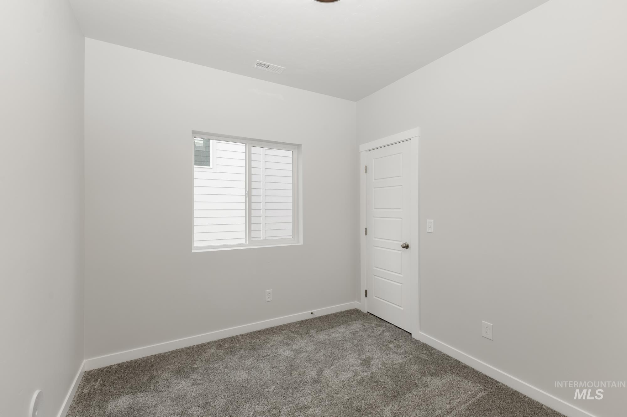 Spare room with carpet flooring