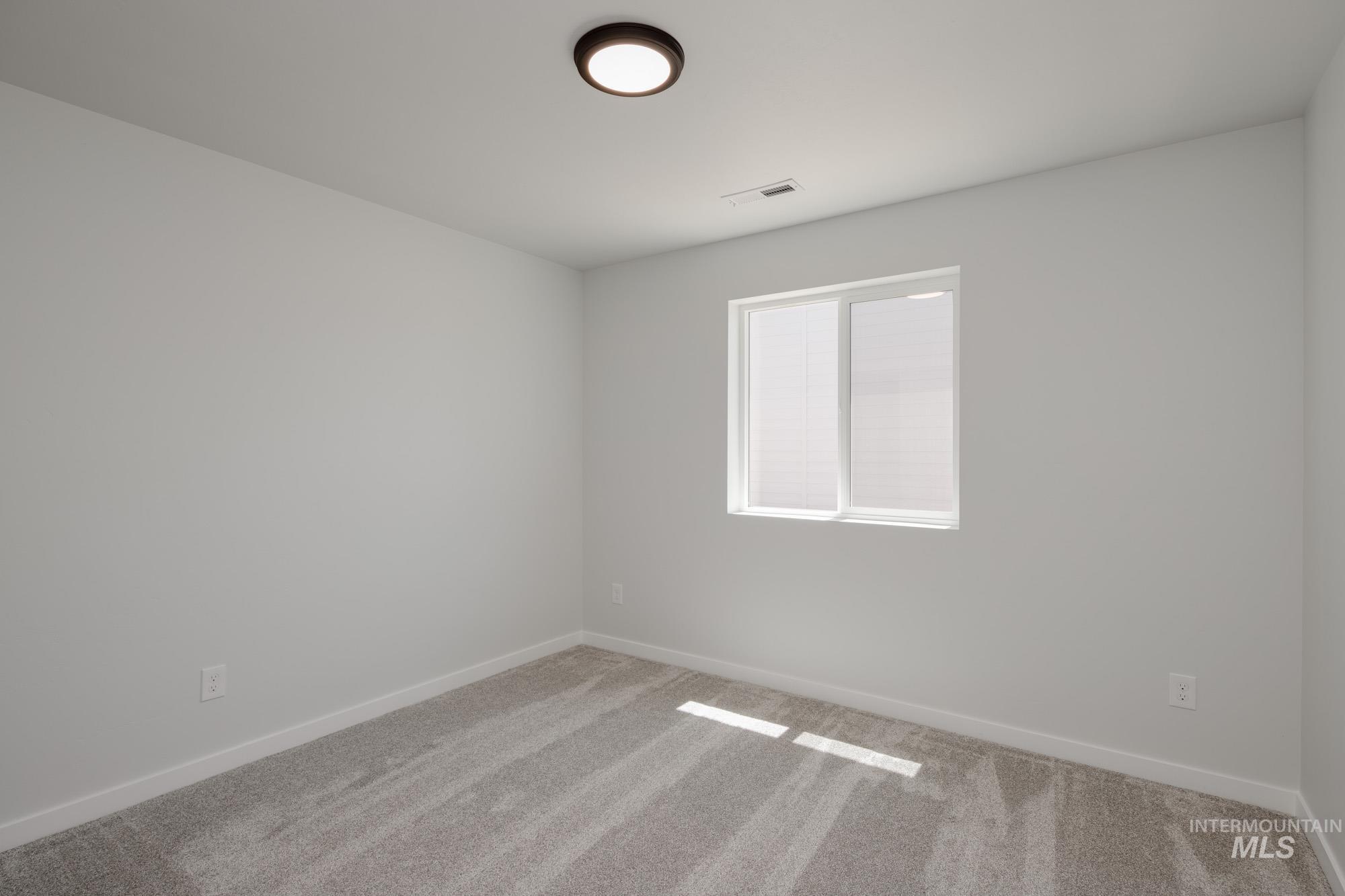 Unfurnished room featuring carpet flooring and baseboards