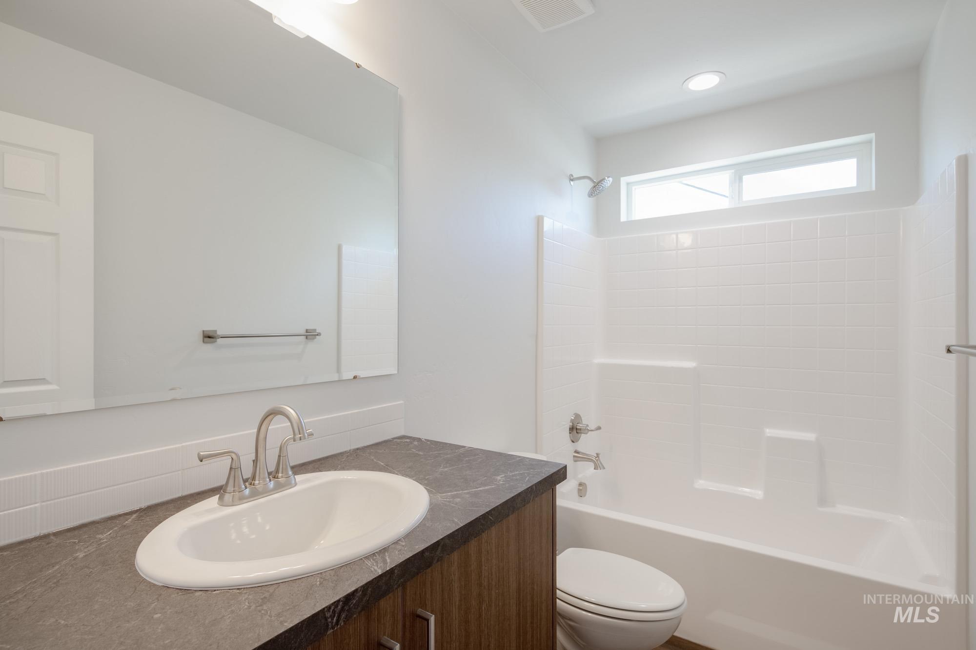 Full bathroom featuring  shower combination and vanity