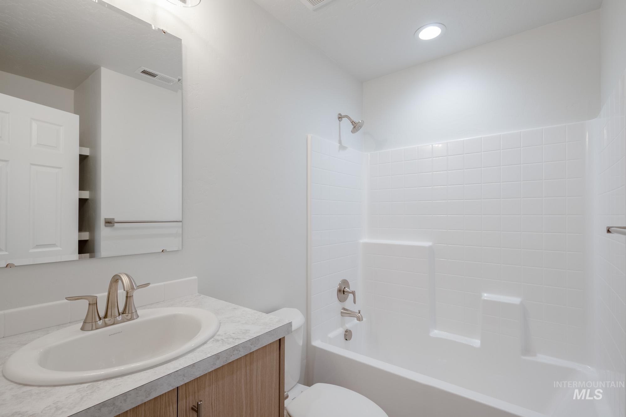Bathroom with tub / shower combination and vanity