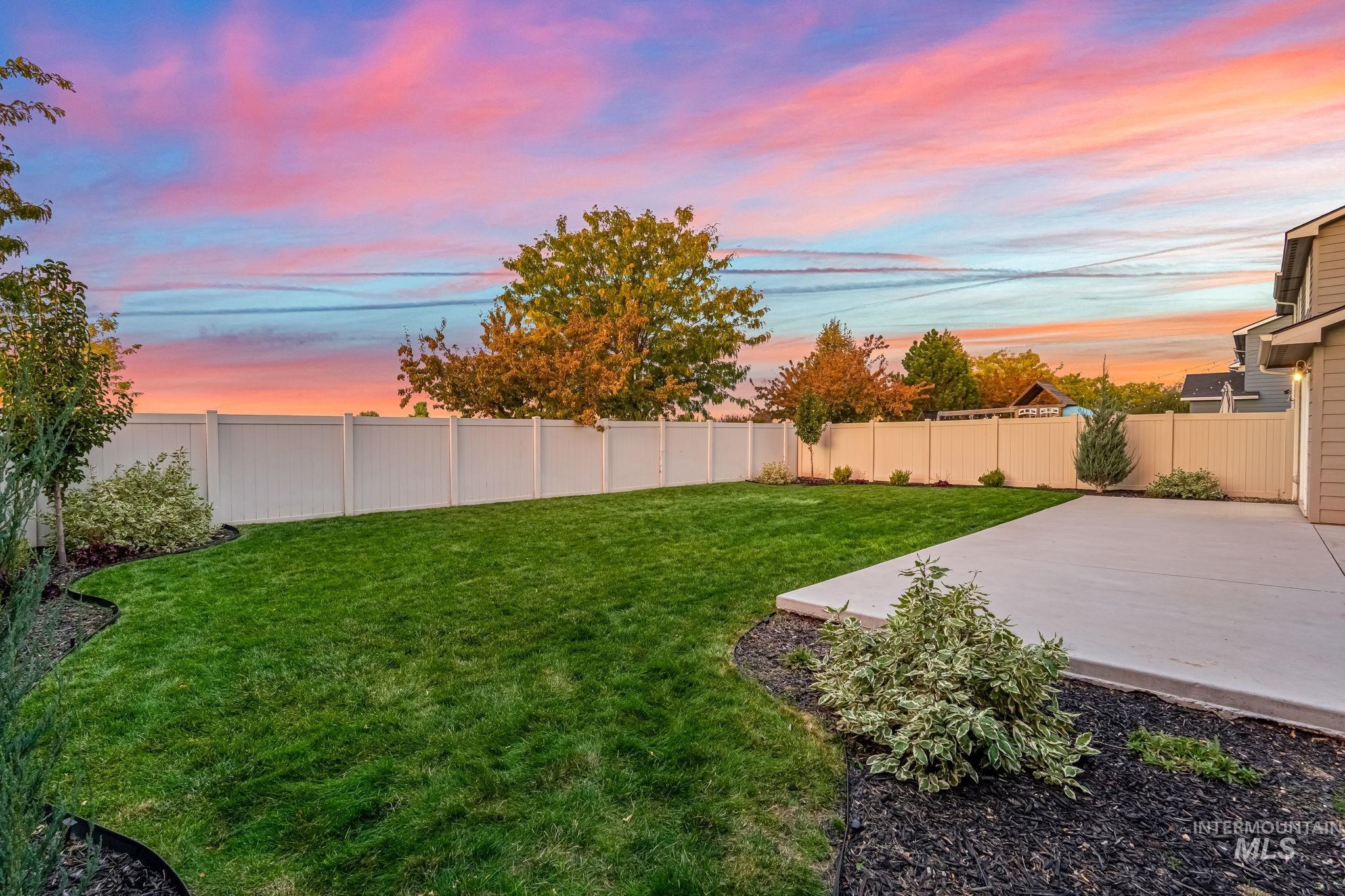 Fenced backyard featuring a patio