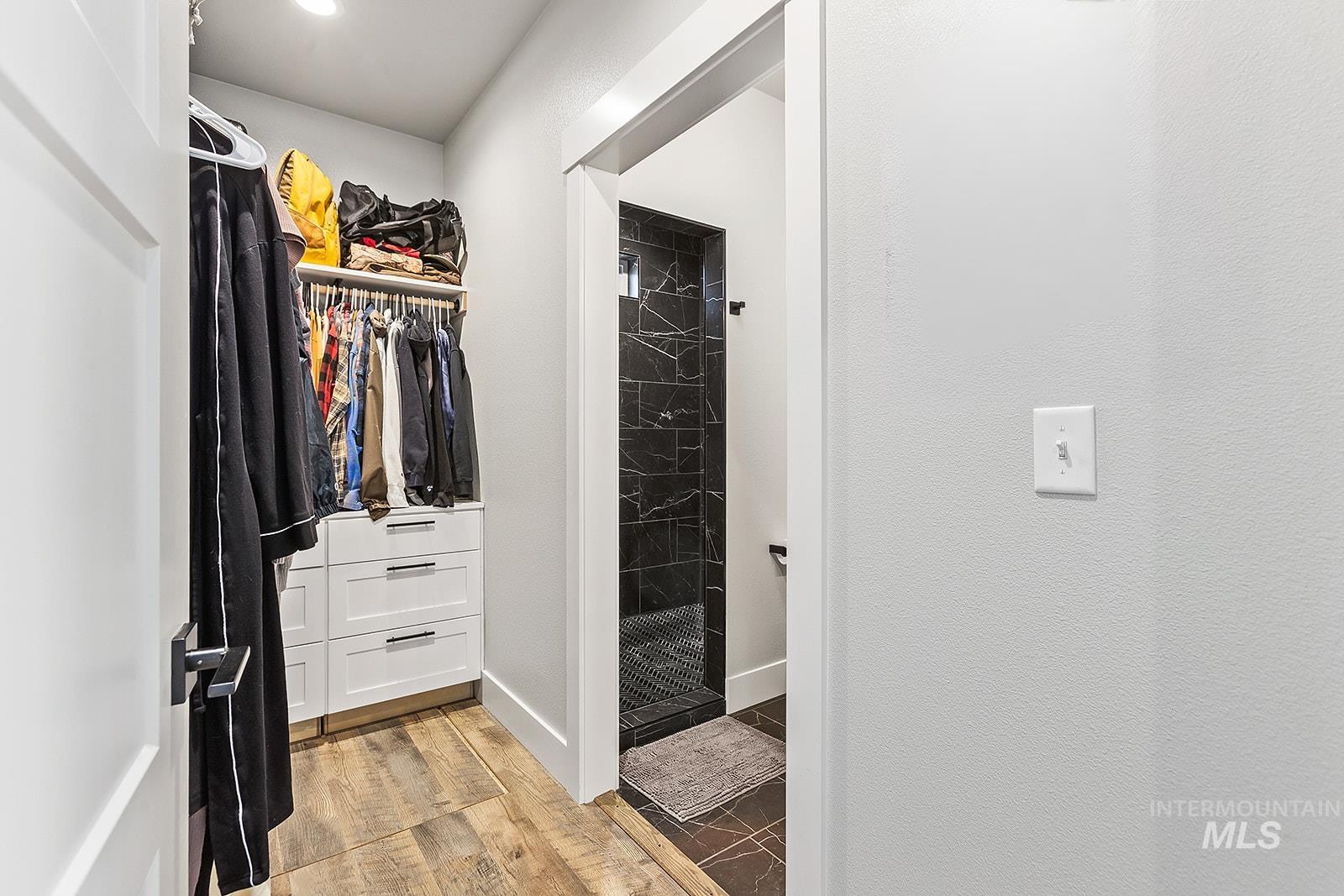 Spacious closet featuring light wood finished floors