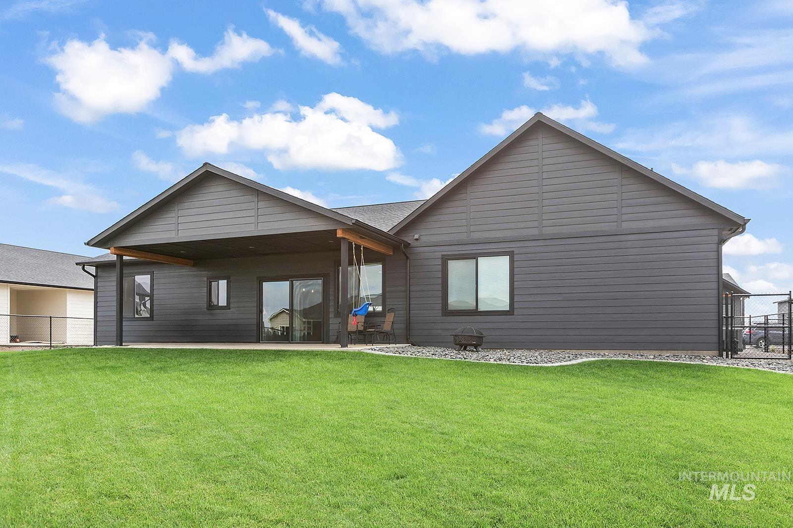 Back of house with a patio area