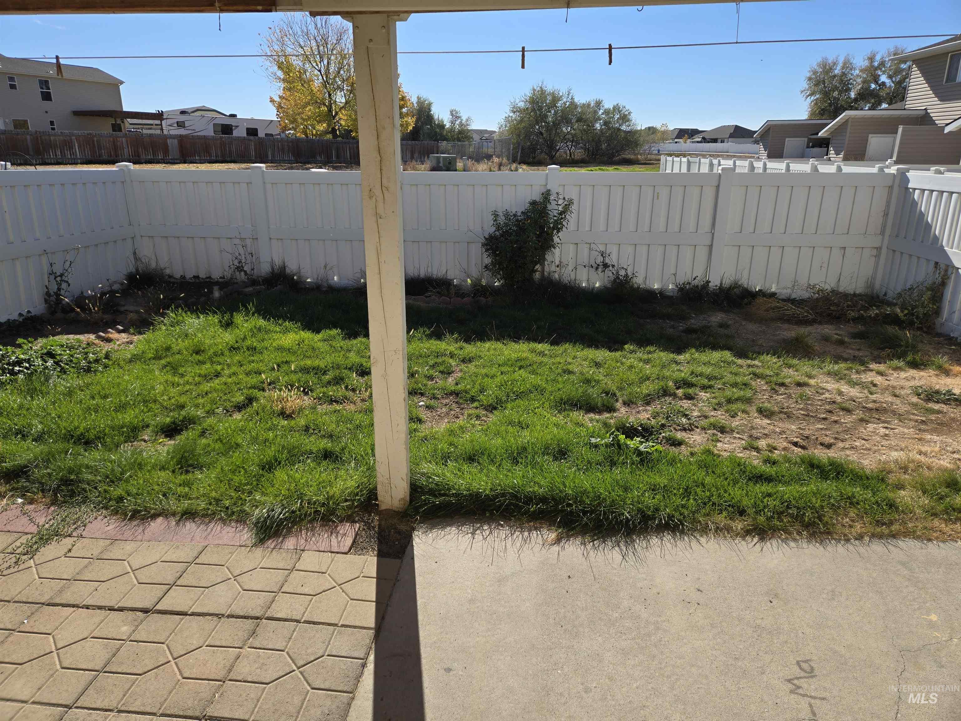 View of fenced backyard