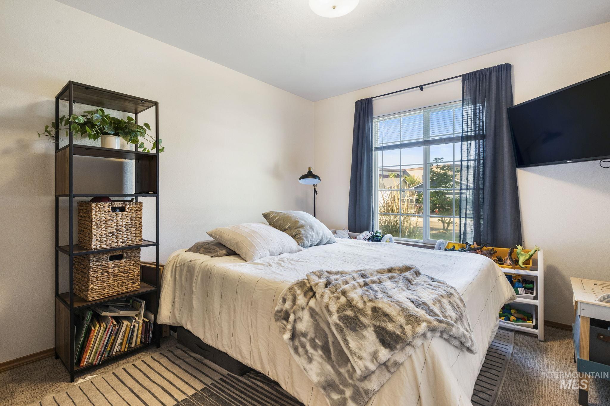 Bedroom with dark carpet